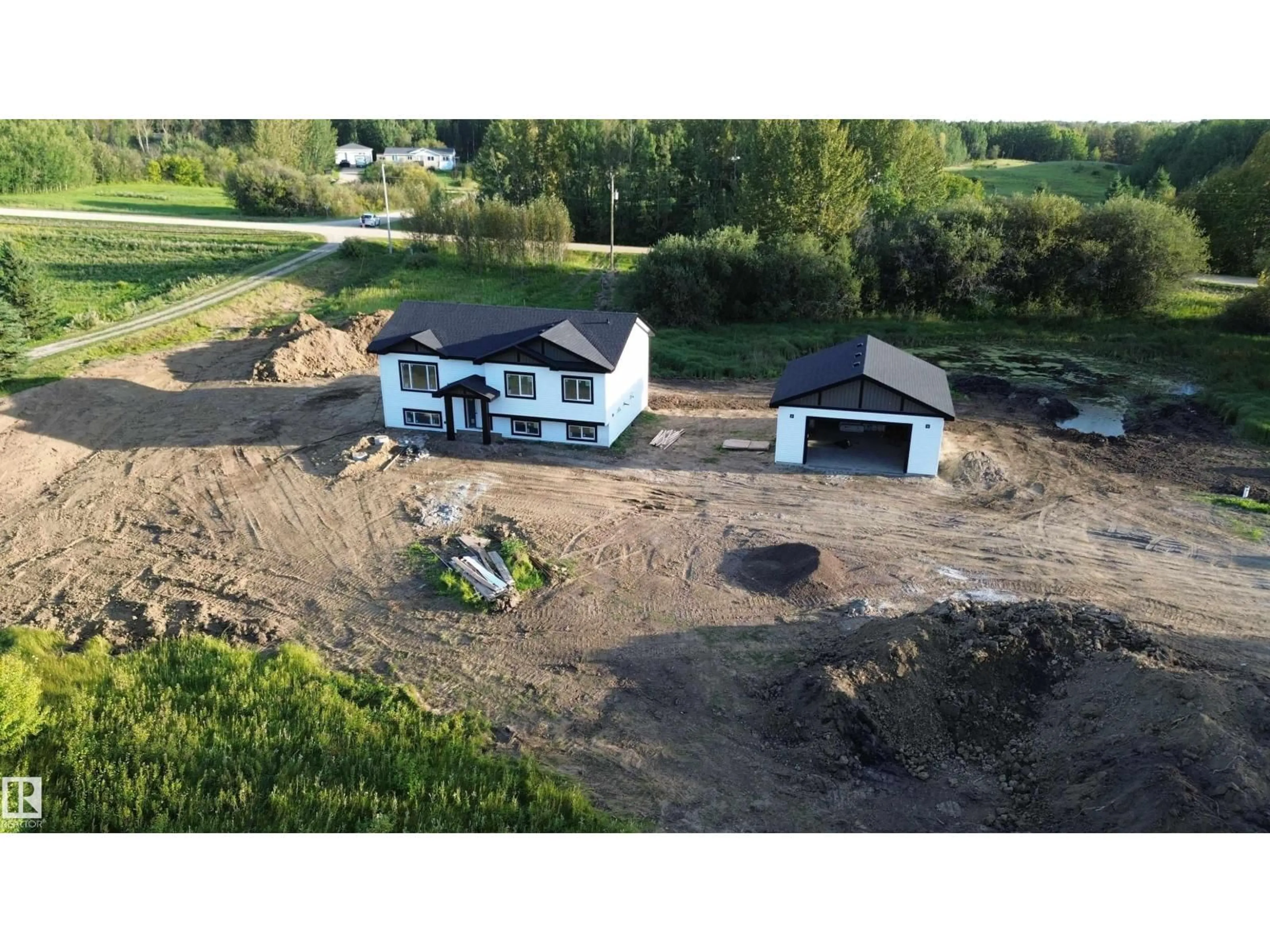 A pic from outside/outdoor area/front of a property/back of a property/a pic from drone, building for #14 - 52510 RGE ROAD 25, Rural Parkland County Alberta T7Y2M2