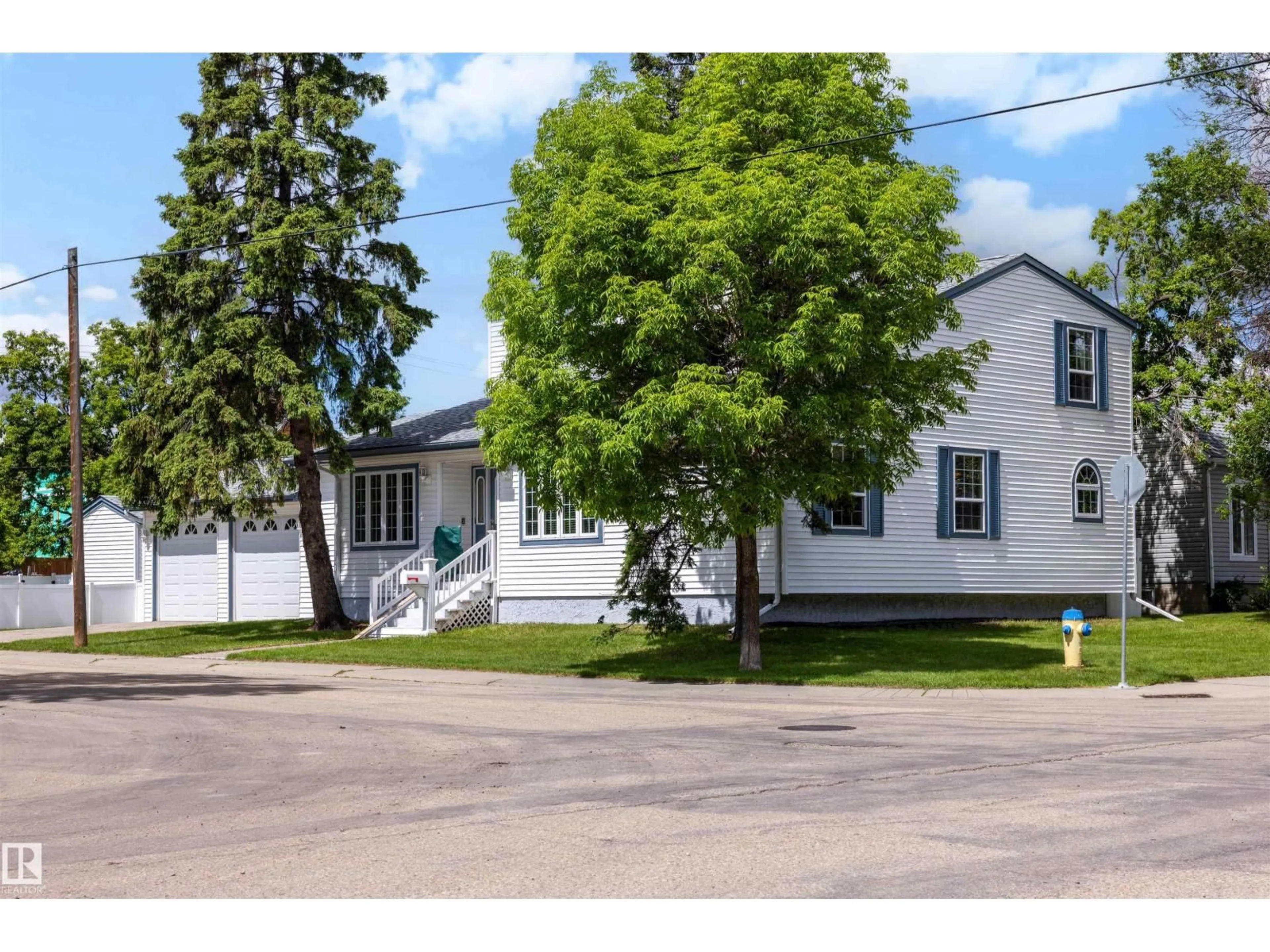 Home with vinyl exterior material, street for 15310 108 AV, Edmonton Alberta T5P1A2