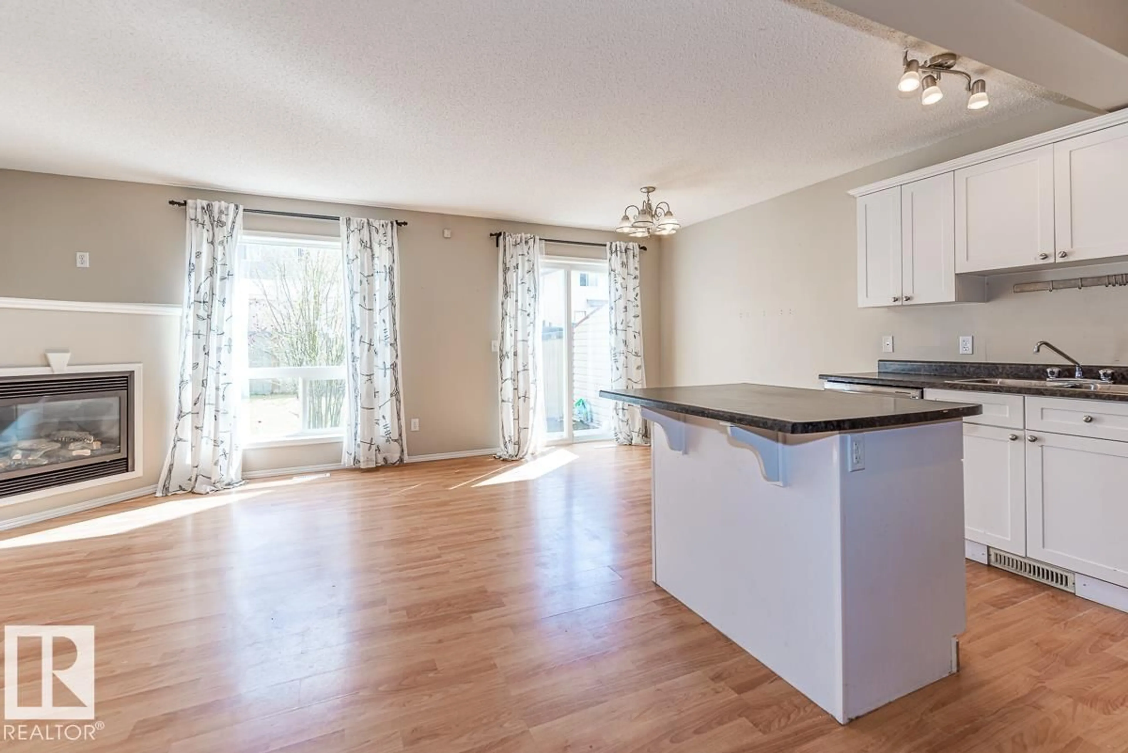Open concept kitchen, wood/laminate floor for 39 VEGA AV, Spruce Grove Alberta T7X4R8