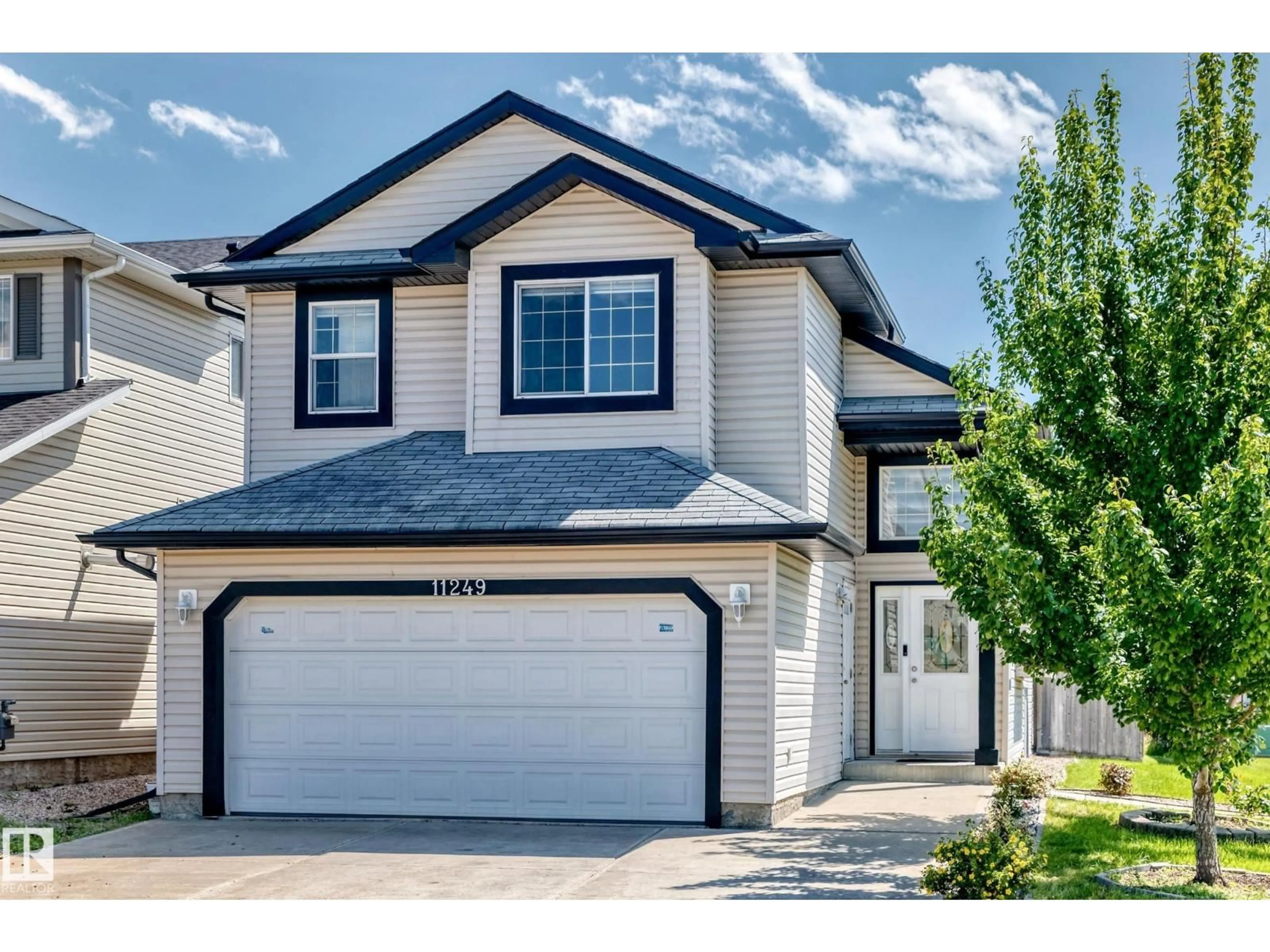 Home with vinyl exterior material, street for 11249 167A AV, Edmonton Alberta T5X0A8