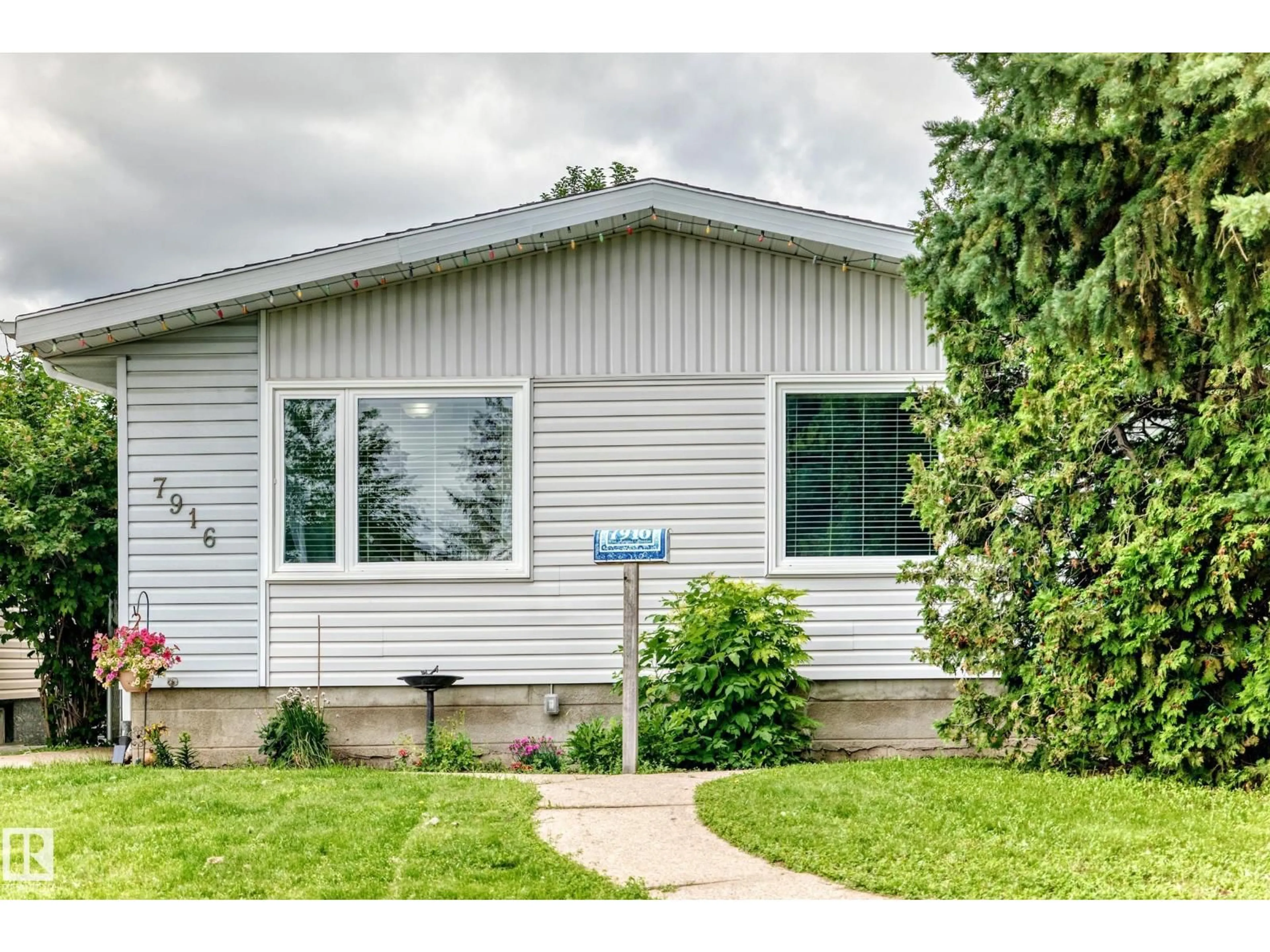 Home with vinyl exterior material, street for 7916 130 AV, Edmonton Alberta T5C1Y5