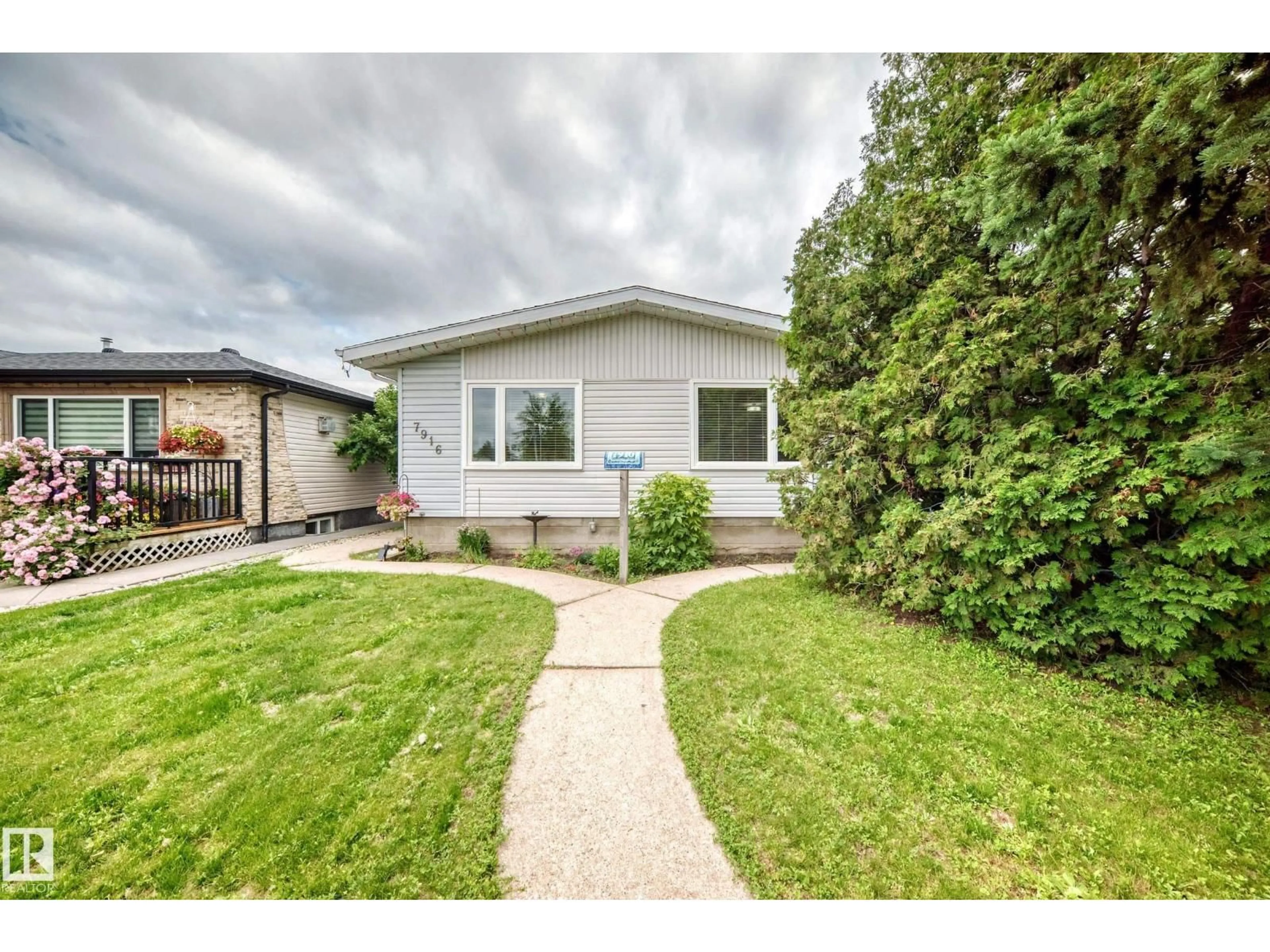 Home with vinyl exterior material, street for 7916 130 AV, Edmonton Alberta T5C1Y5