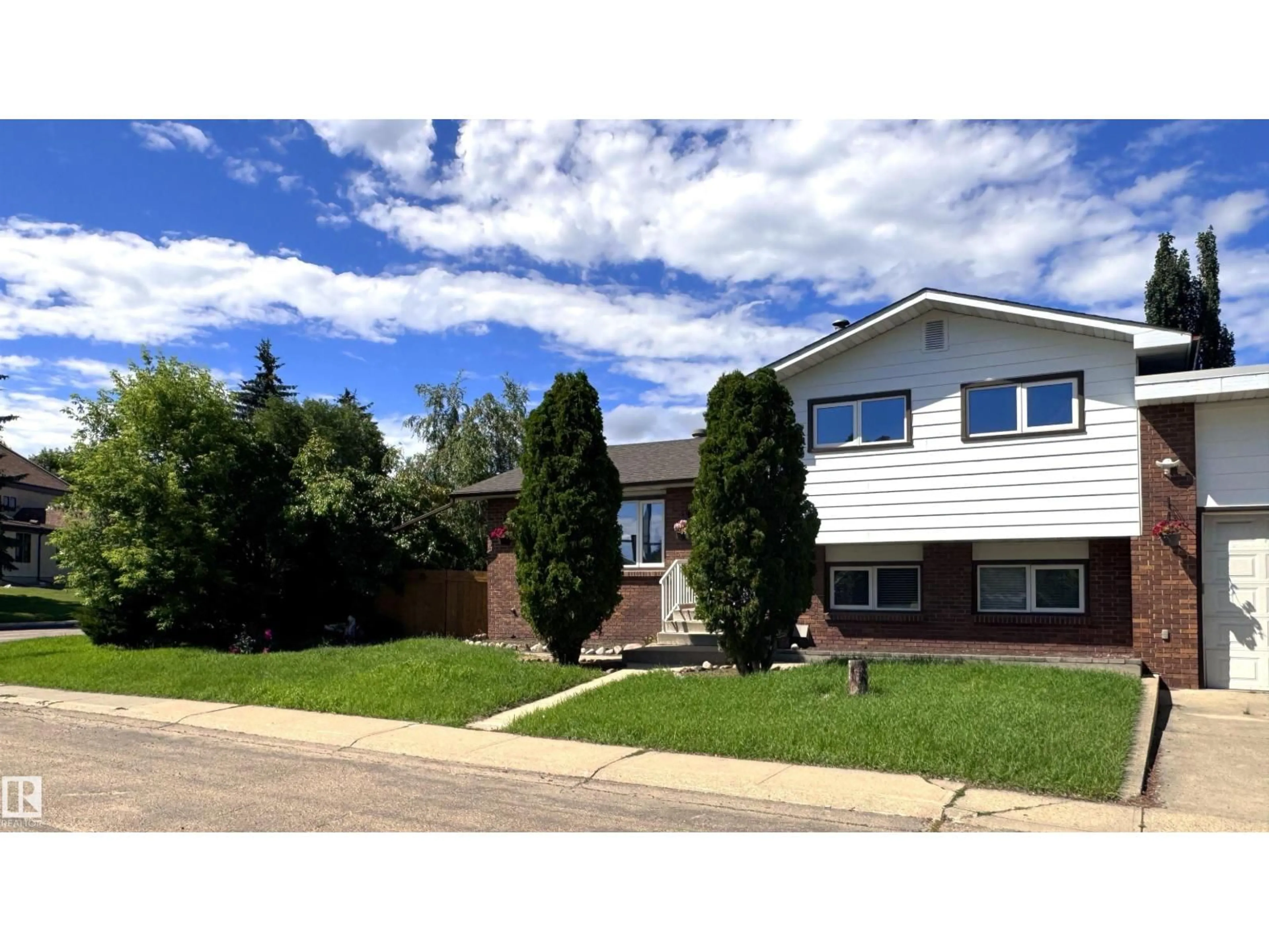 Home with vinyl exterior material, street for 7312 137 AV, Edmonton Alberta T5C2L5