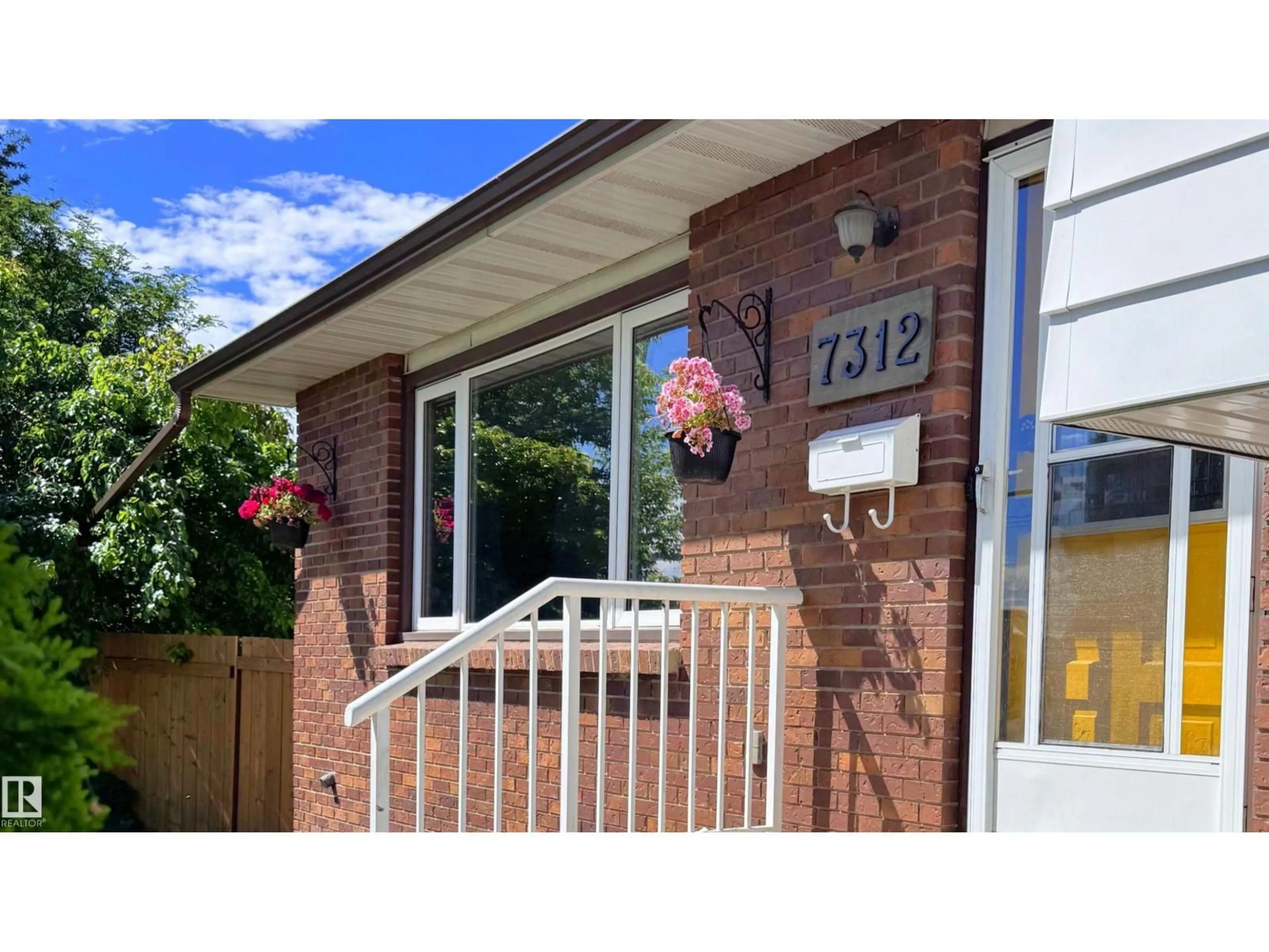 Home with brick exterior material, street for 7312 137 AV, Edmonton Alberta T5C2L5