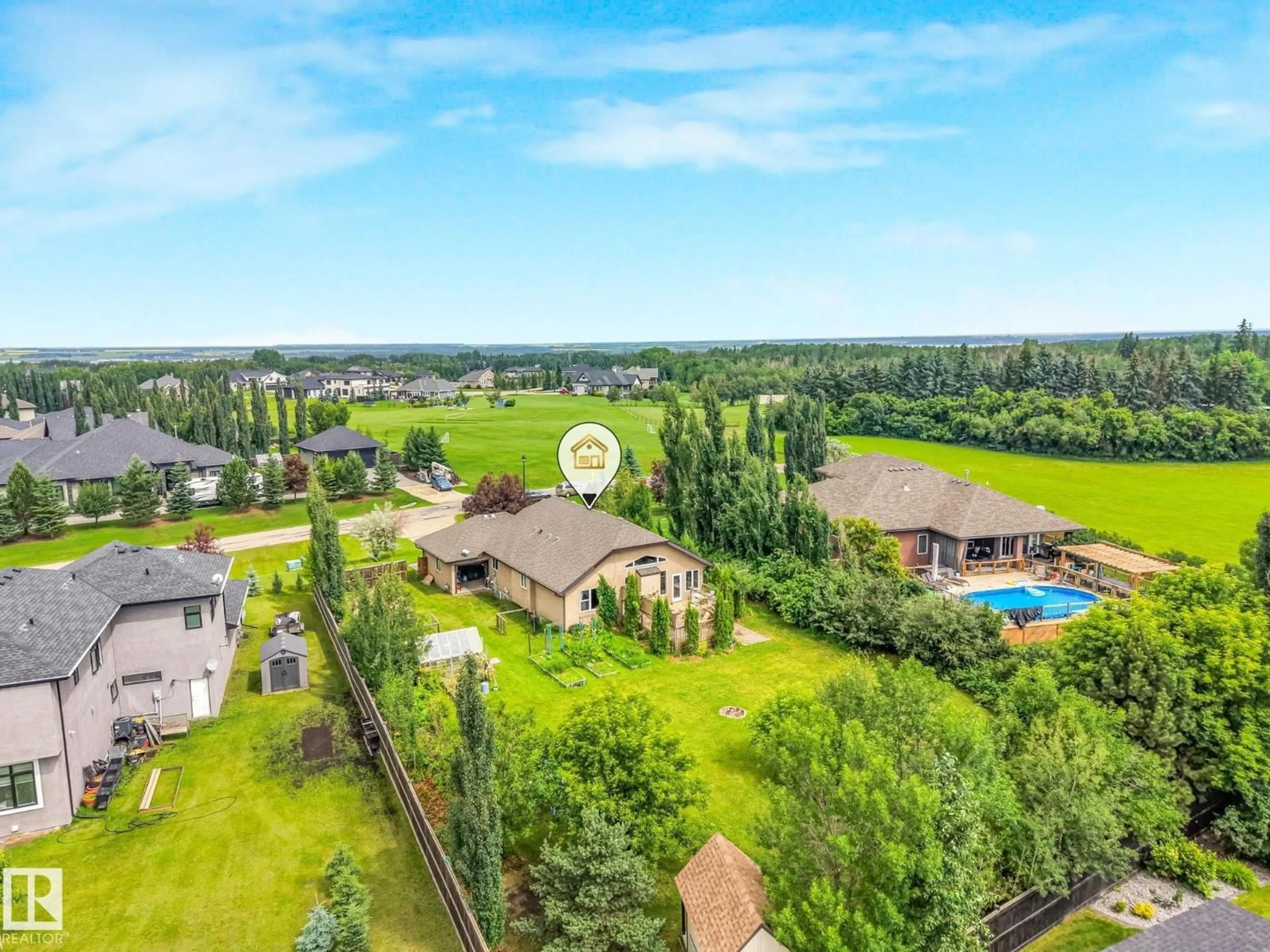 A pic from outside/outdoor area/front of a property/back of a property/a pic from drone, water/lake/river/ocean view for 59 26107 TWP ROAD 532 A, Rural Parkland County Alberta T6J2R2