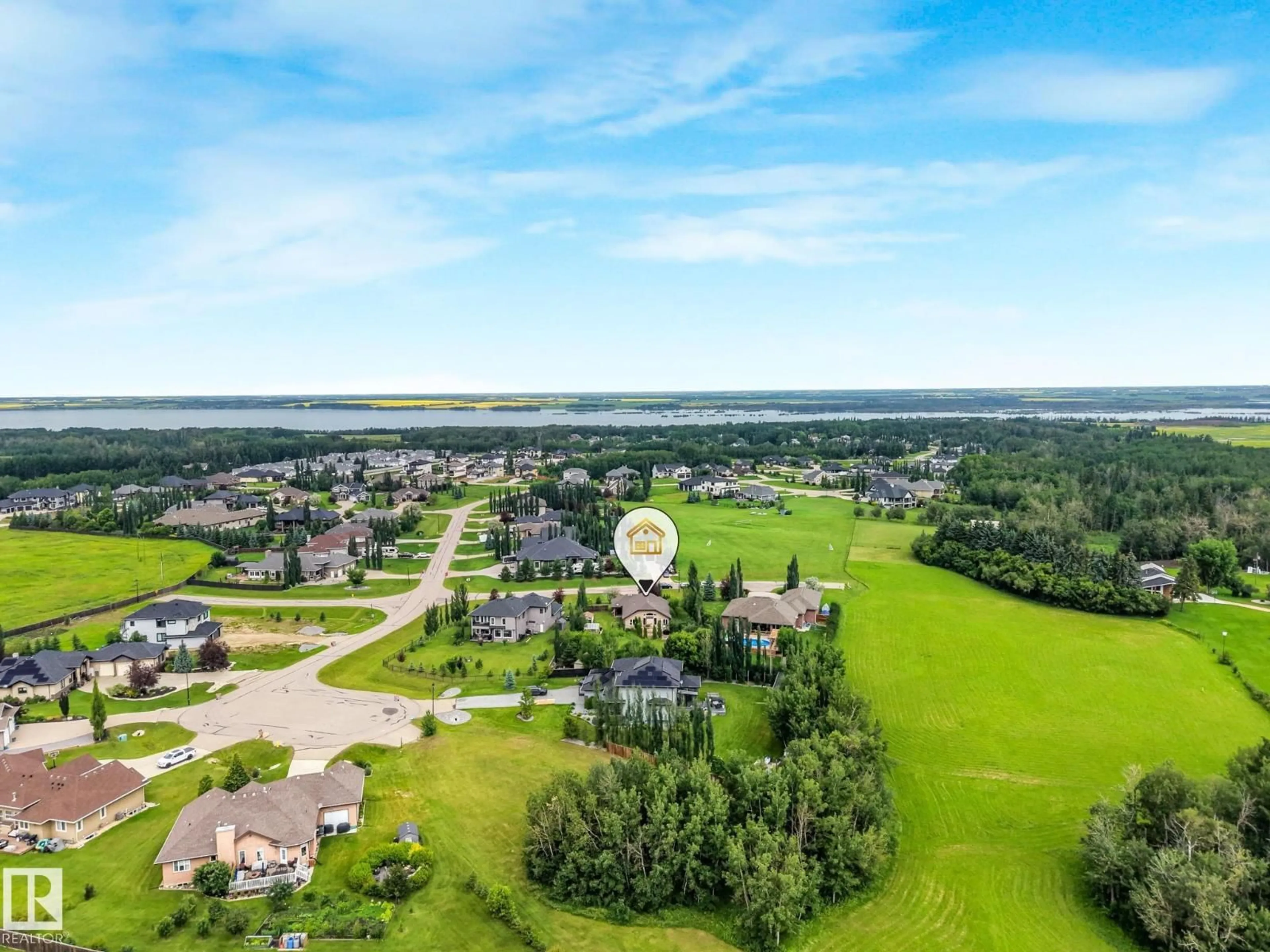 A pic from outside/outdoor area/front of a property/back of a property/a pic from drone, water/lake/river/ocean view for 59 26107 TWP ROAD 532 A, Rural Parkland County Alberta T6J2R2