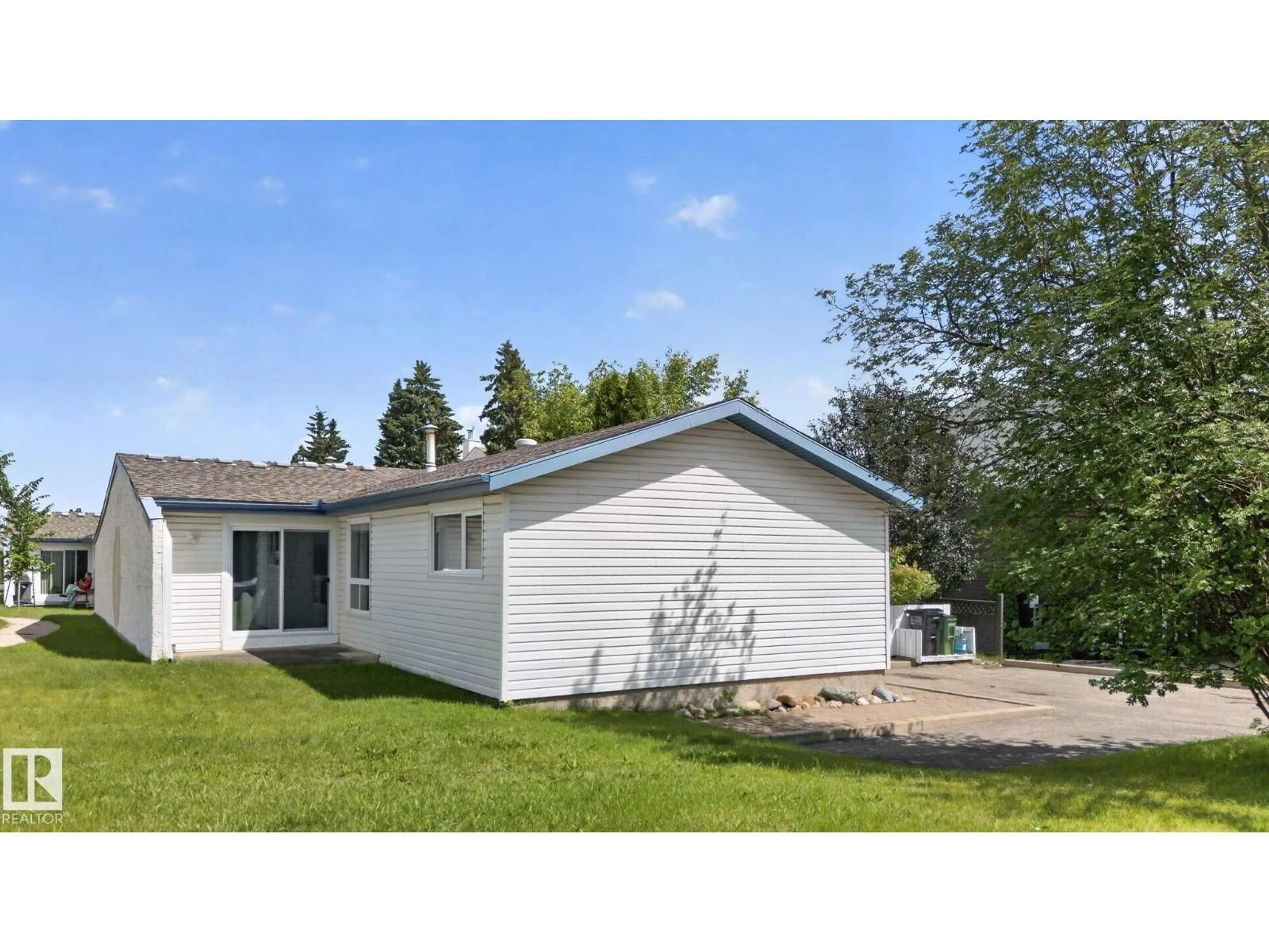 Home with vinyl exterior material, street for 1071 MILLBOURNE RD, Edmonton Alberta T6K0T3