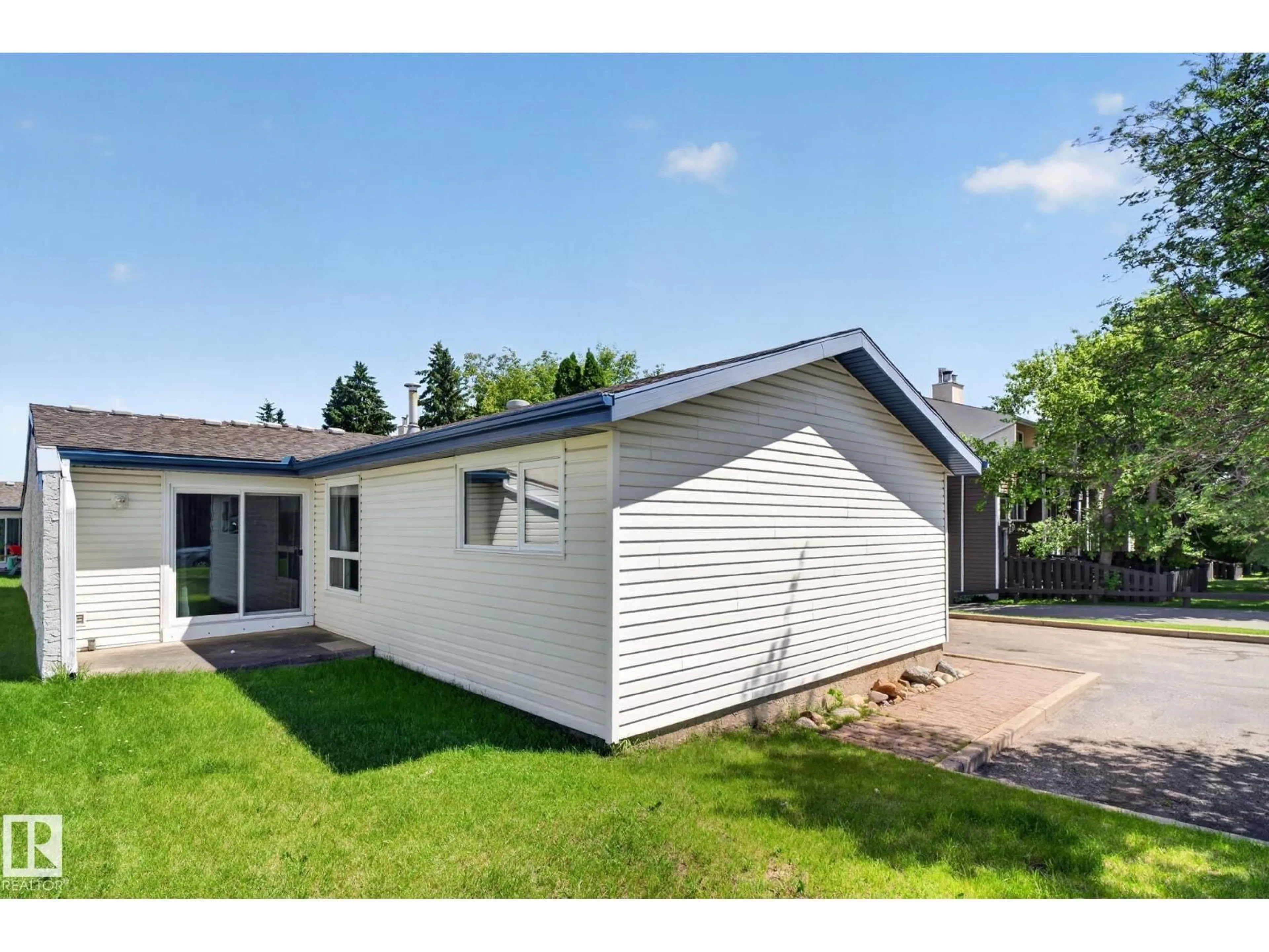 Home with vinyl exterior material, street for 1071 MILLBOURNE RD, Edmonton Alberta T6K0T3