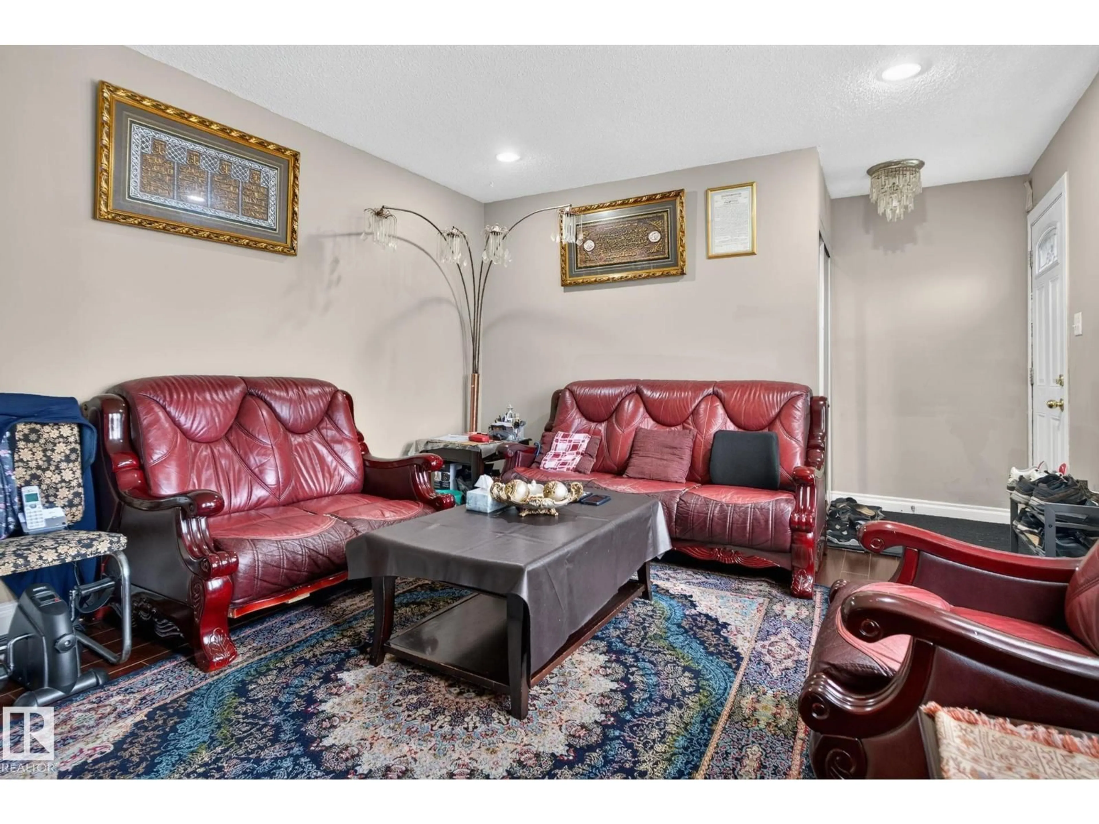 Living room with furniture, unknown for NW - 8614 and 8616 128 AV, Edmonton Alberta T5E0G2