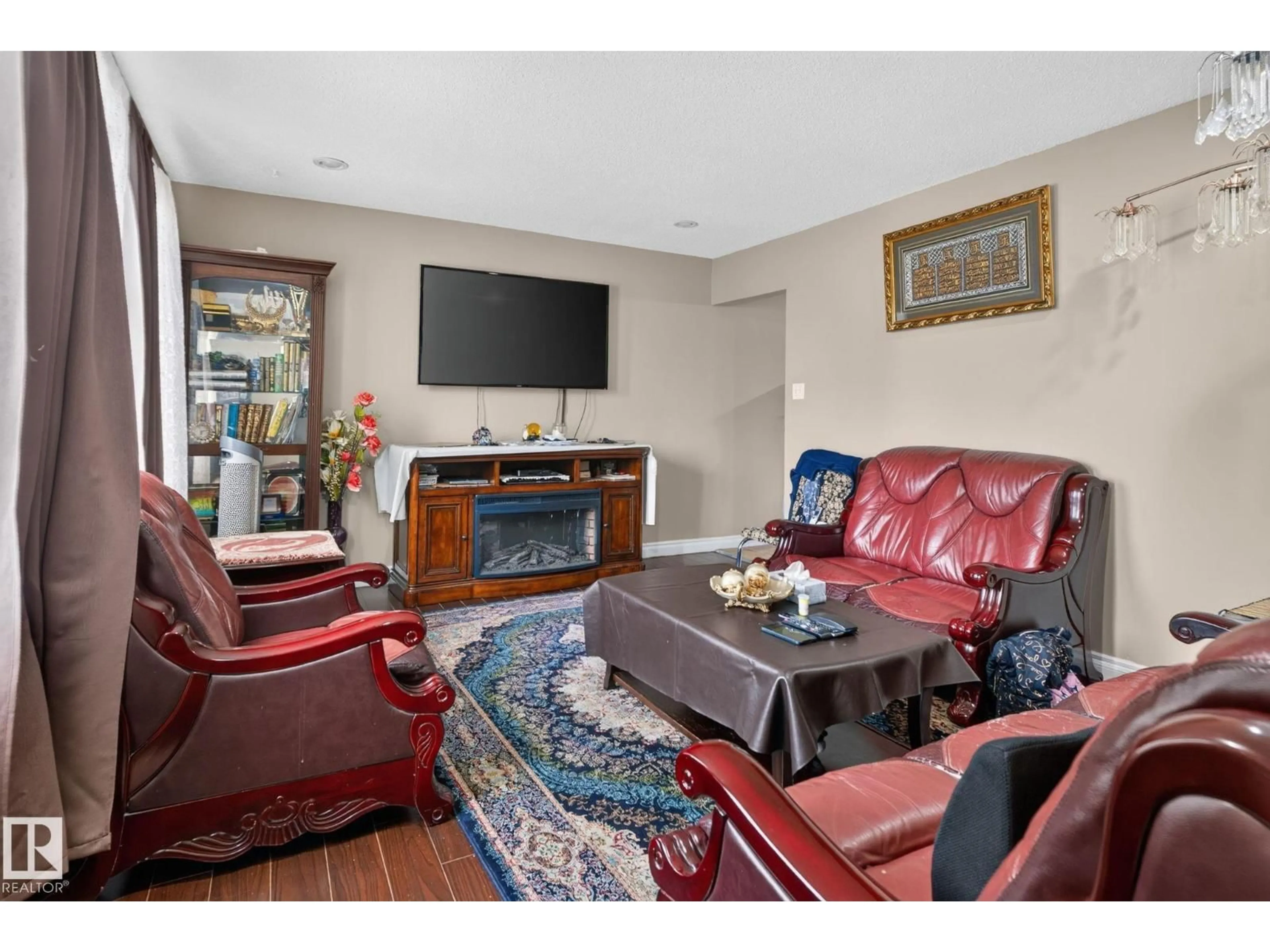 Living room with furniture, unknown for NW - 8614 and 8616 128 AV, Edmonton Alberta T5E0G2