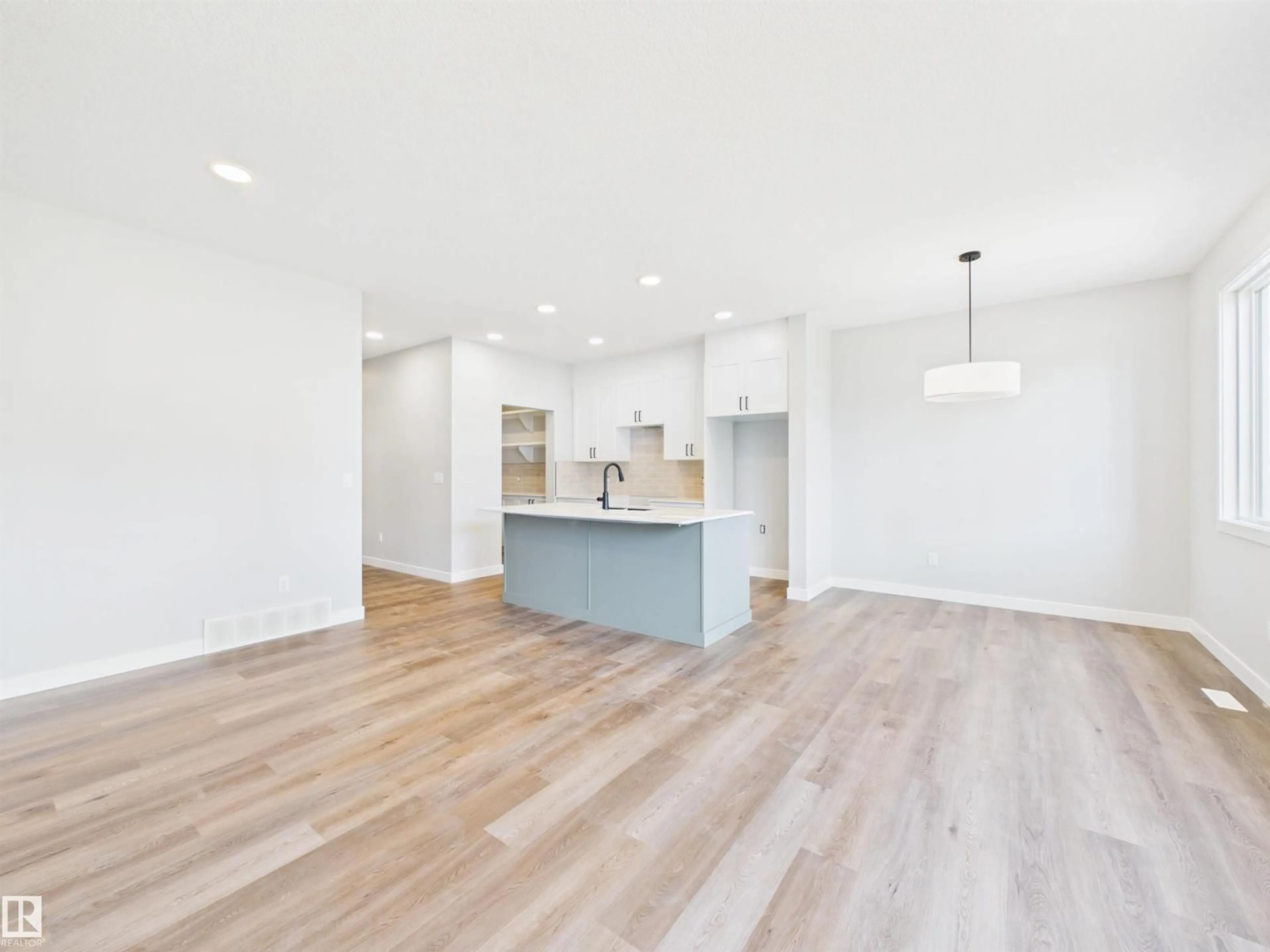 Open concept kitchen, wood/laminate floor for 139 CALEDON CR, Spruce Grove Alberta T7X4T4