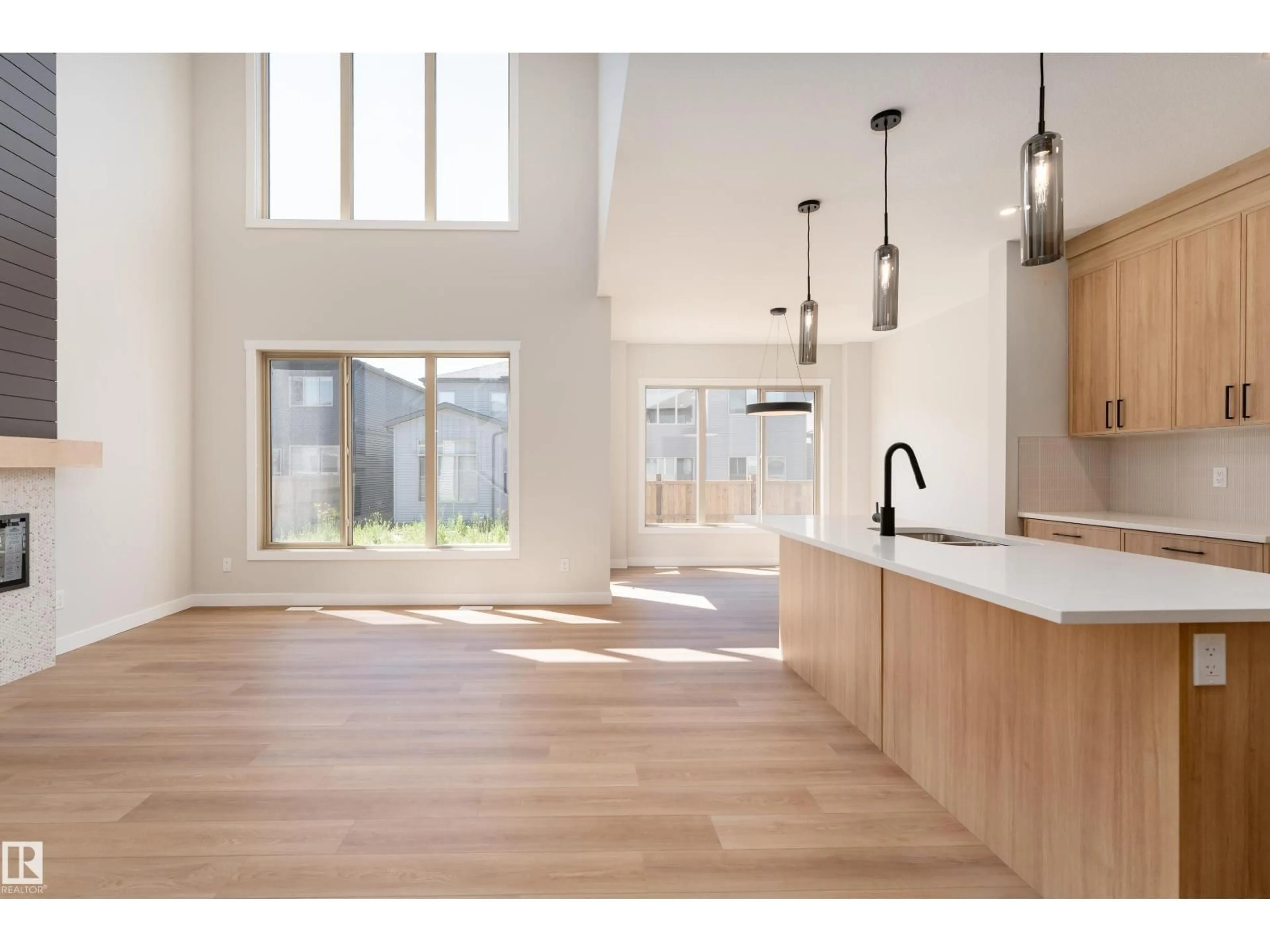Open concept kitchen, wood/laminate floor for 117 GARNEAU GA, Spruce Grove Alberta T7X2Y6