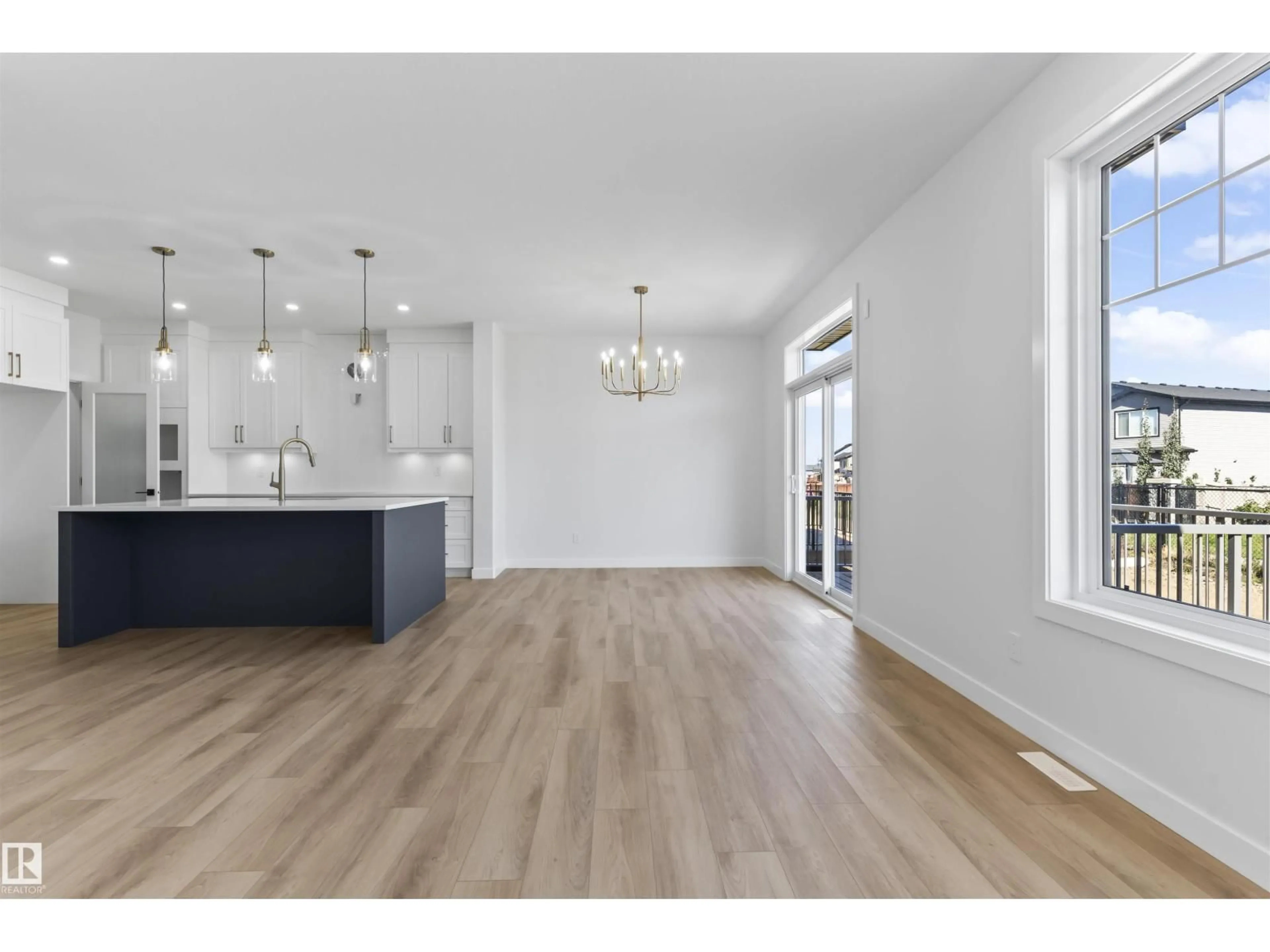 Open concept kitchen, wood/laminate floor for 208 FALCON CRESCENT, Leduc Alberta T0B3M3