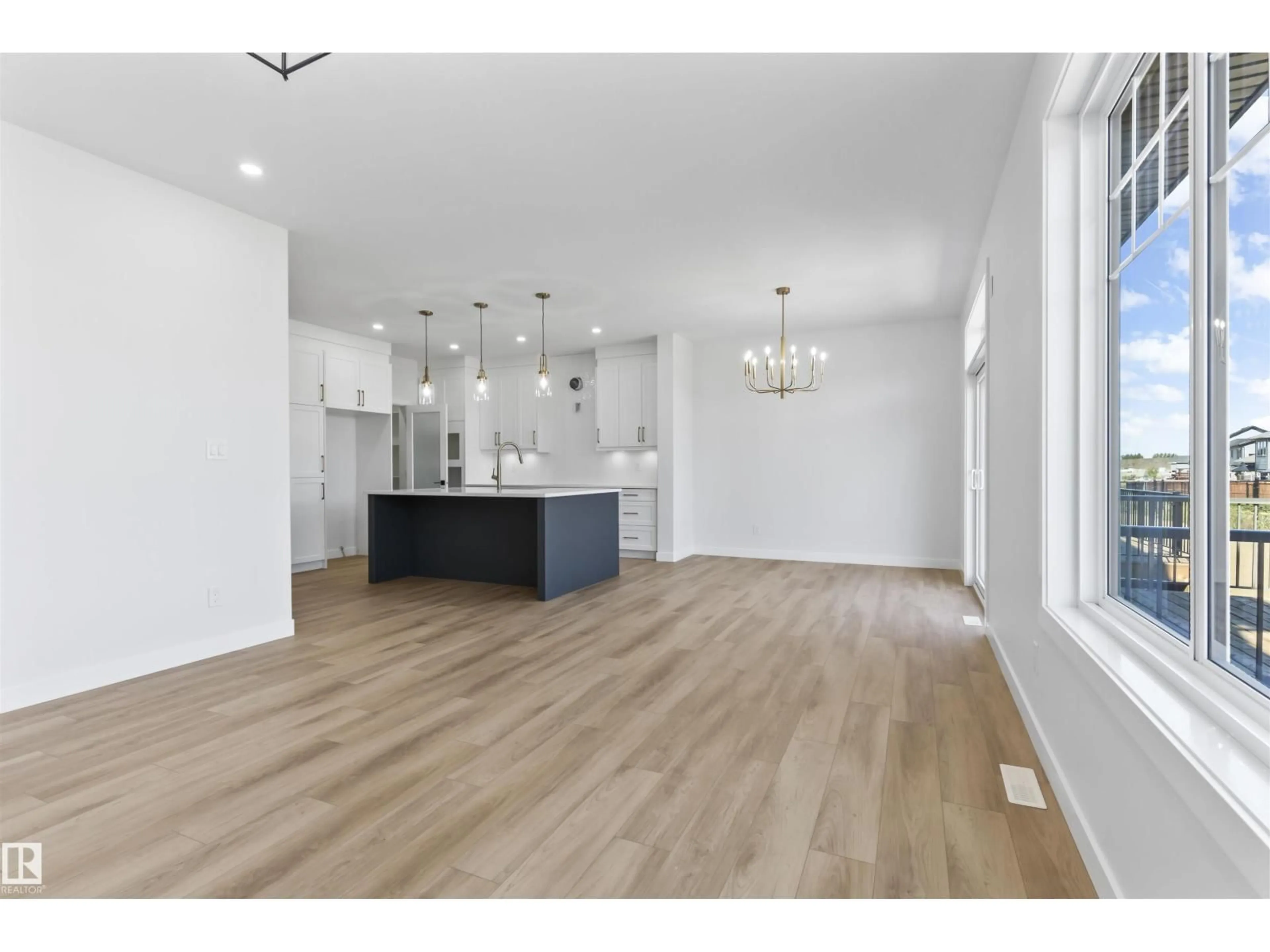 Open concept kitchen, wood/laminate floor for 208 FALCON CRESCENT, Leduc Alberta T0B3M3