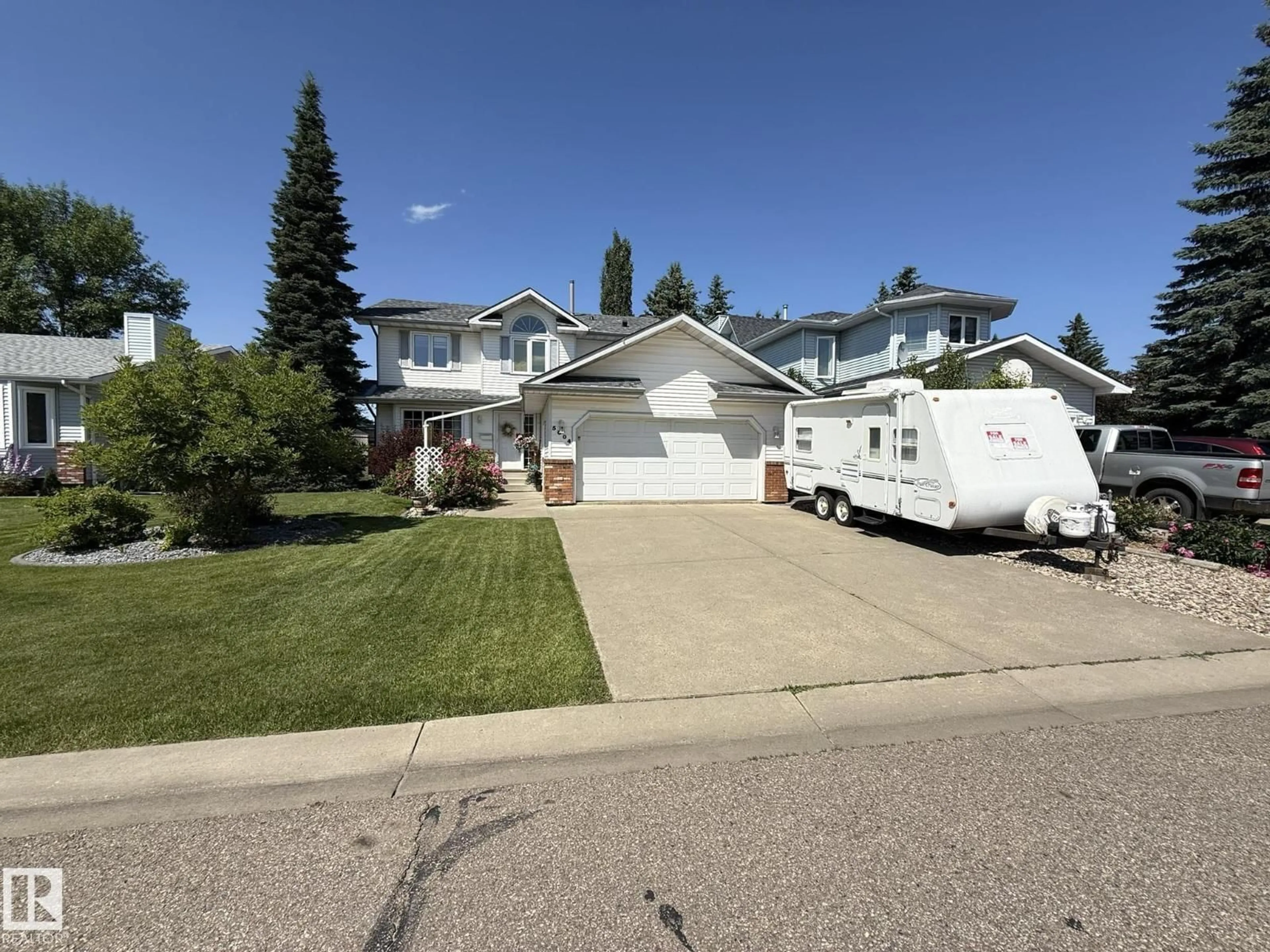 Home with vinyl exterior material, street for 5604 57 AV, Beaumont Alberta T4X1A7