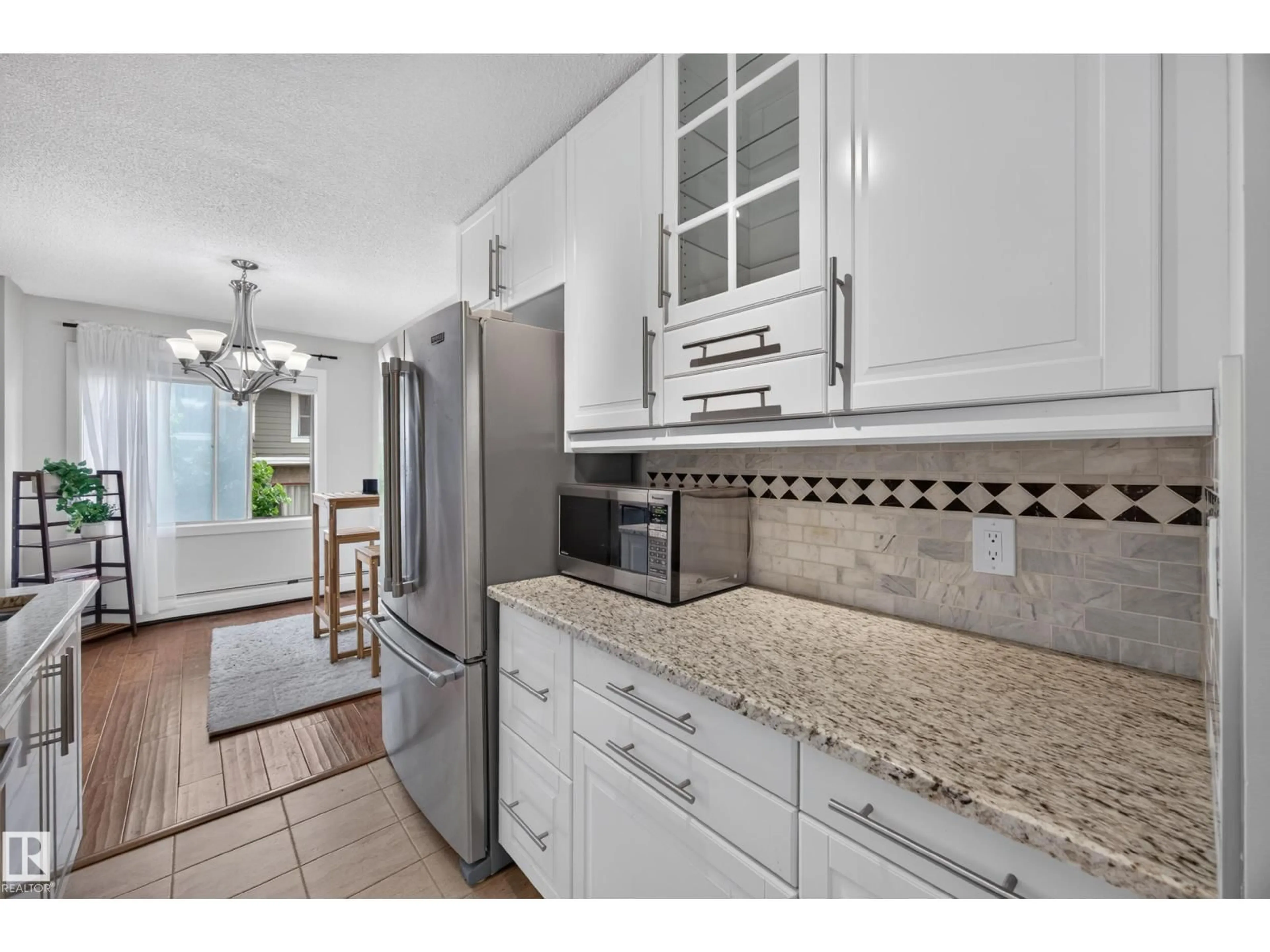 Open concept kitchen, ceramic/tile floor for #602 - 9725 106 ST NW, Edmonton Alberta T5K1B5