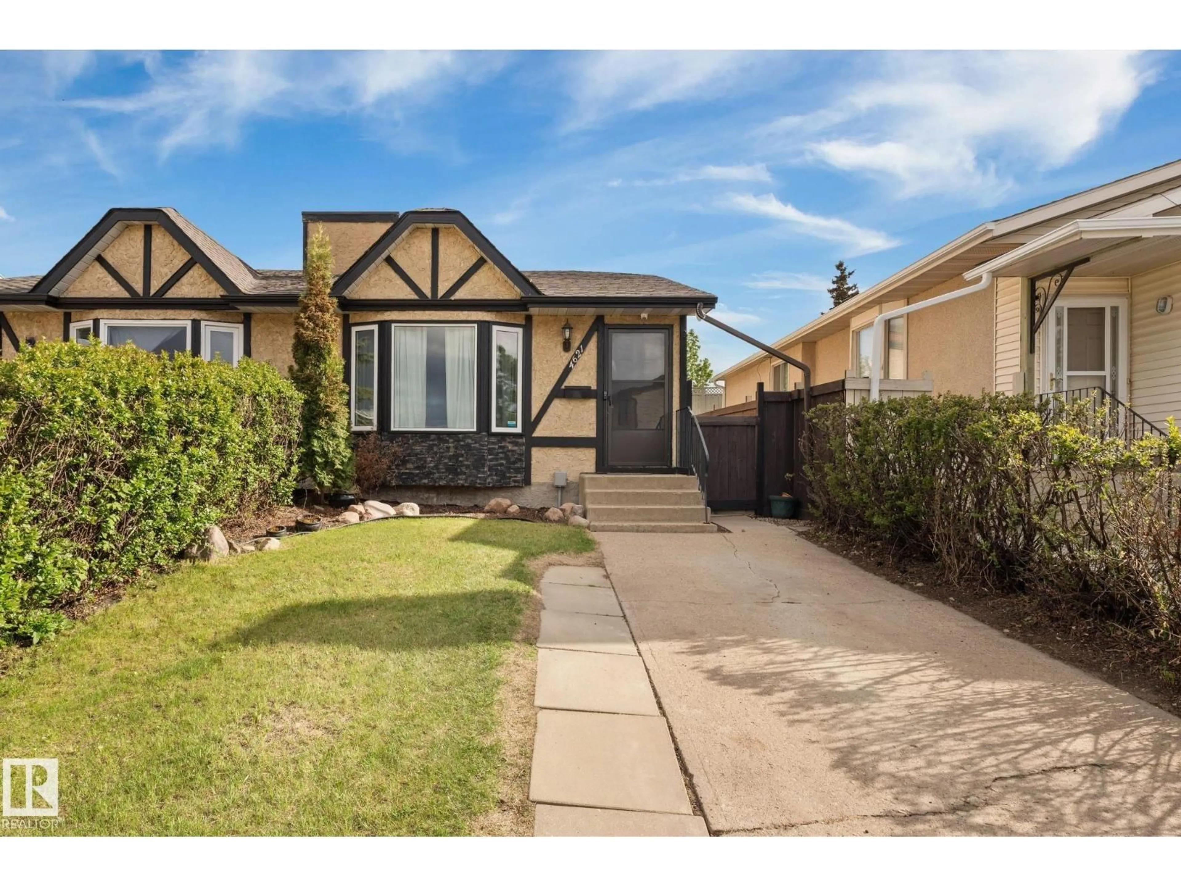 Home with vinyl exterior material, street for 4621 126 AV, Edmonton Alberta T5A4L1