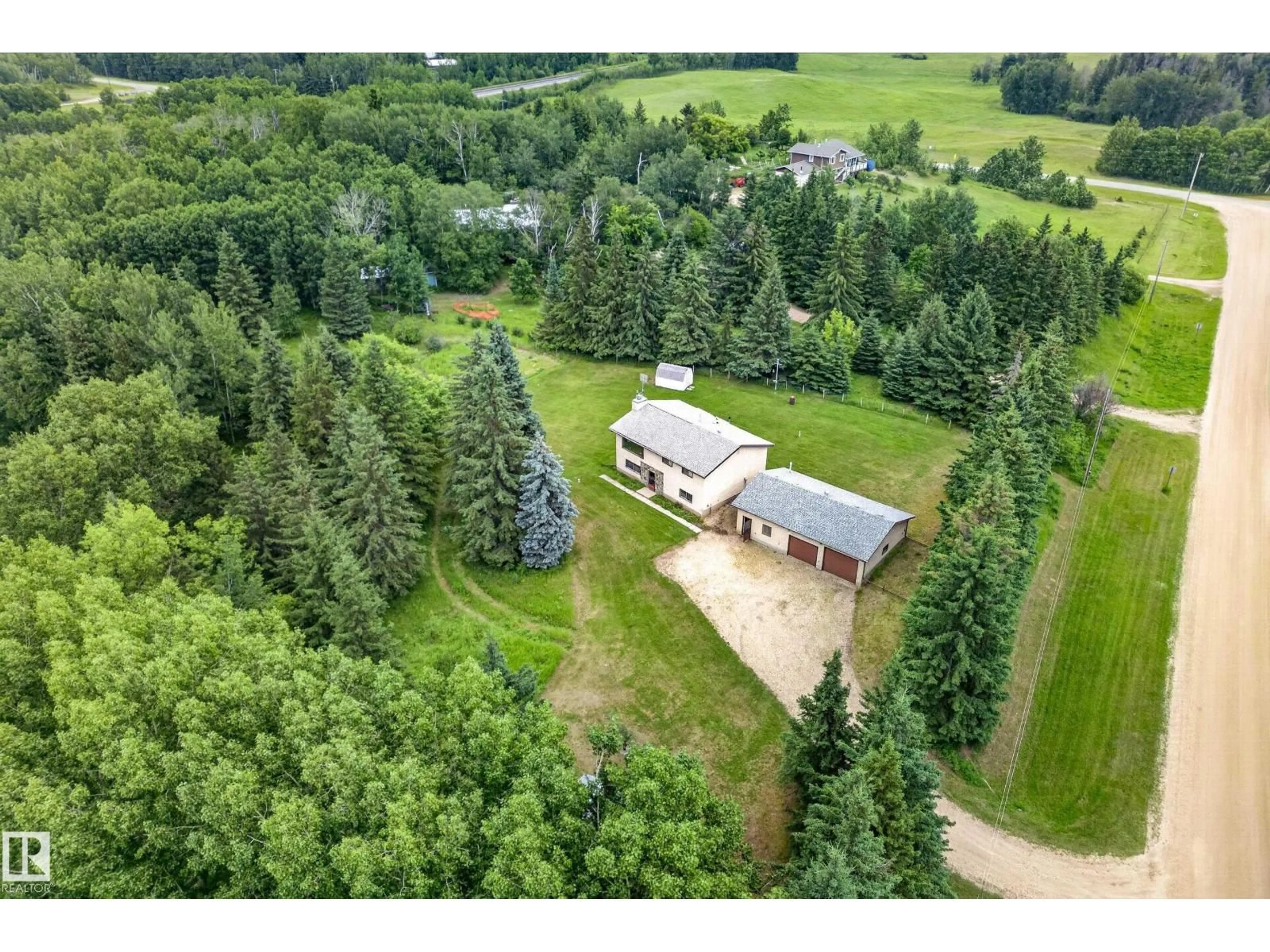 A pic from outside/outdoor area/front of a property/back of a property/a pic from drone, forest/trees view for #6 - 52510 RGE ROAD 20, Rural Parkland County Alberta T7Y2G7