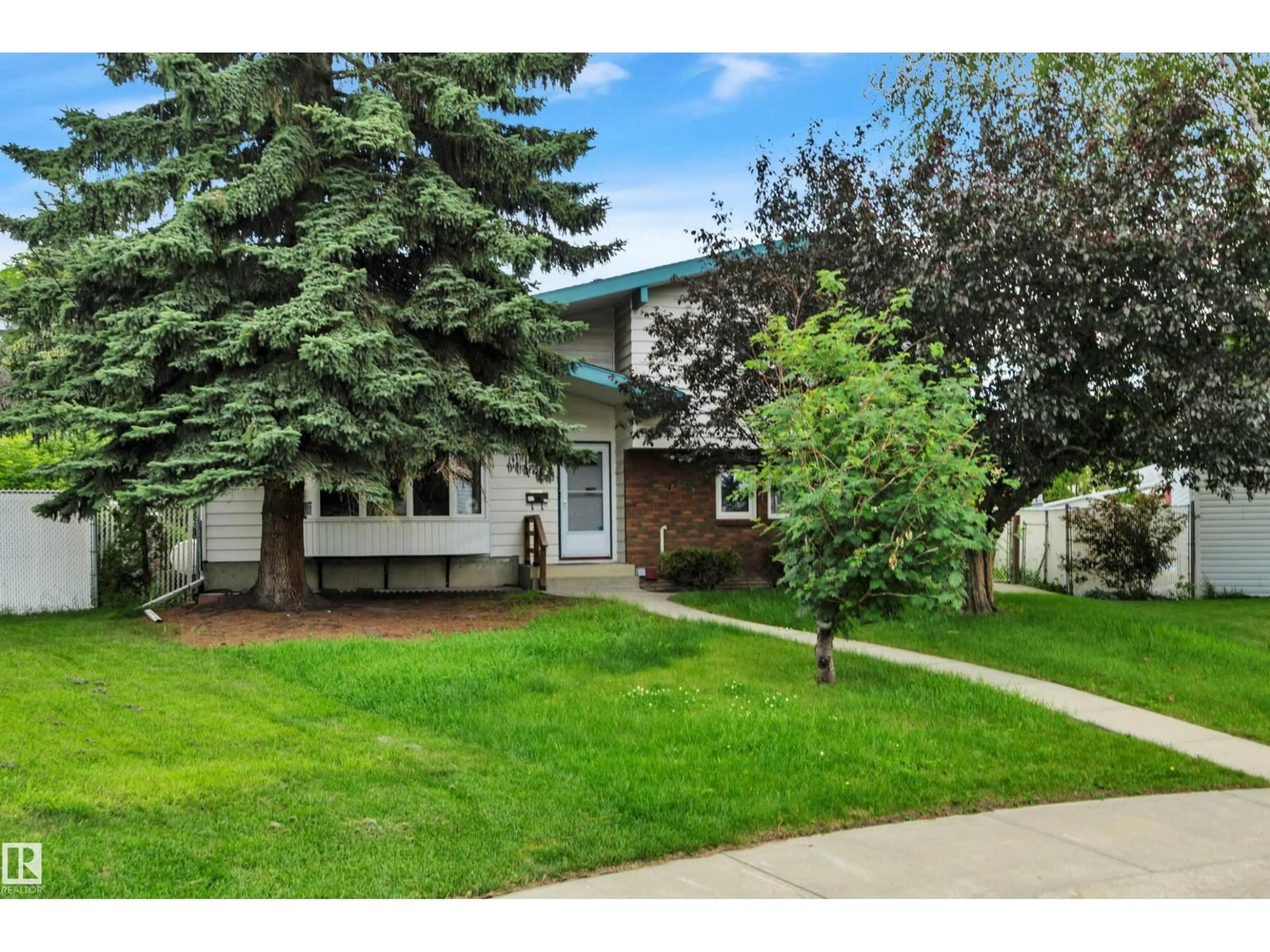 Home with vinyl exterior material, street for 7604 149 AV, Edmonton Alberta T5C2V7