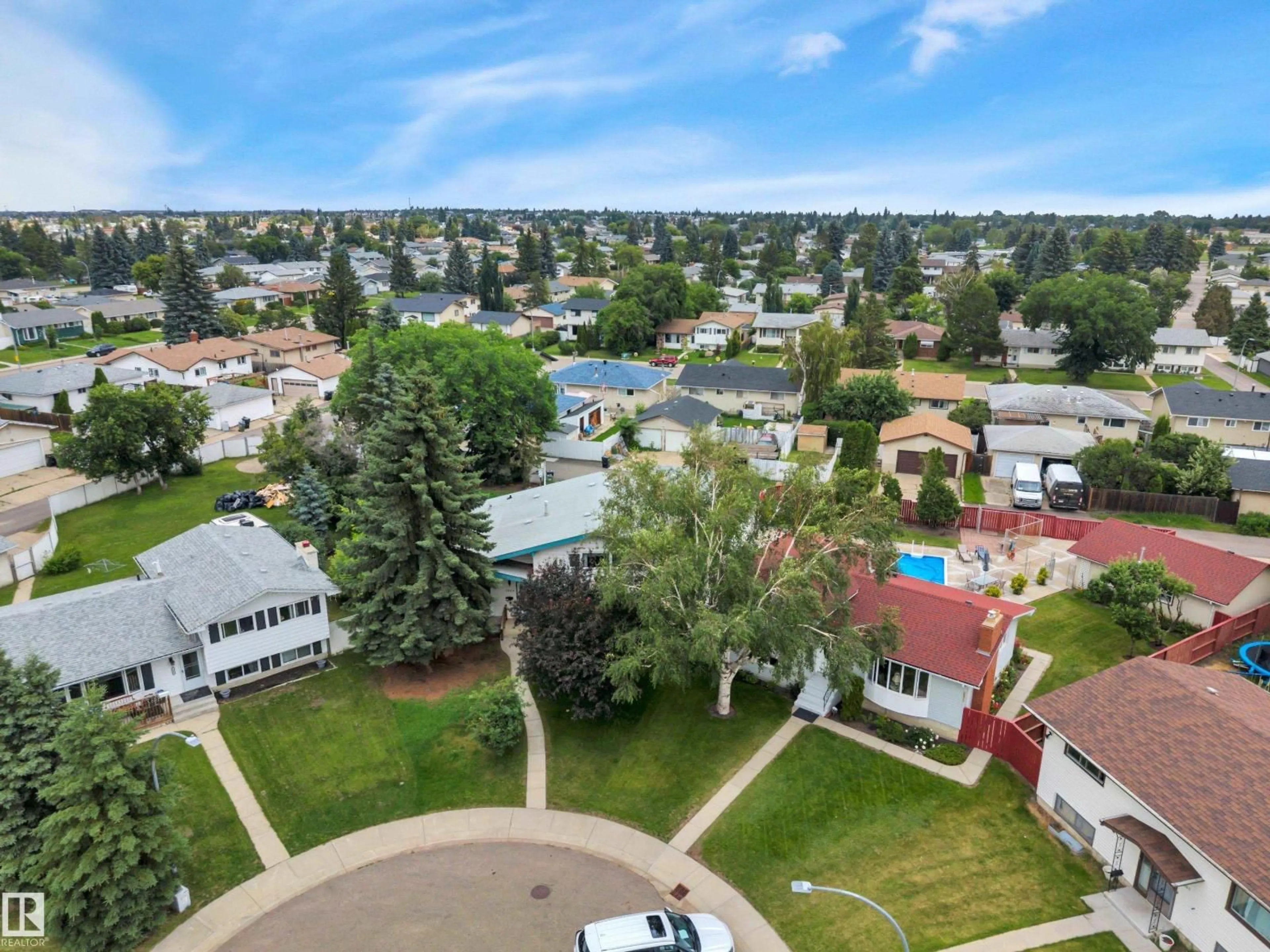 A pic from outside/outdoor area/front of a property/back of a property/a pic from drone, unknown for 7604 149 AV, Edmonton Alberta T5C2V7
