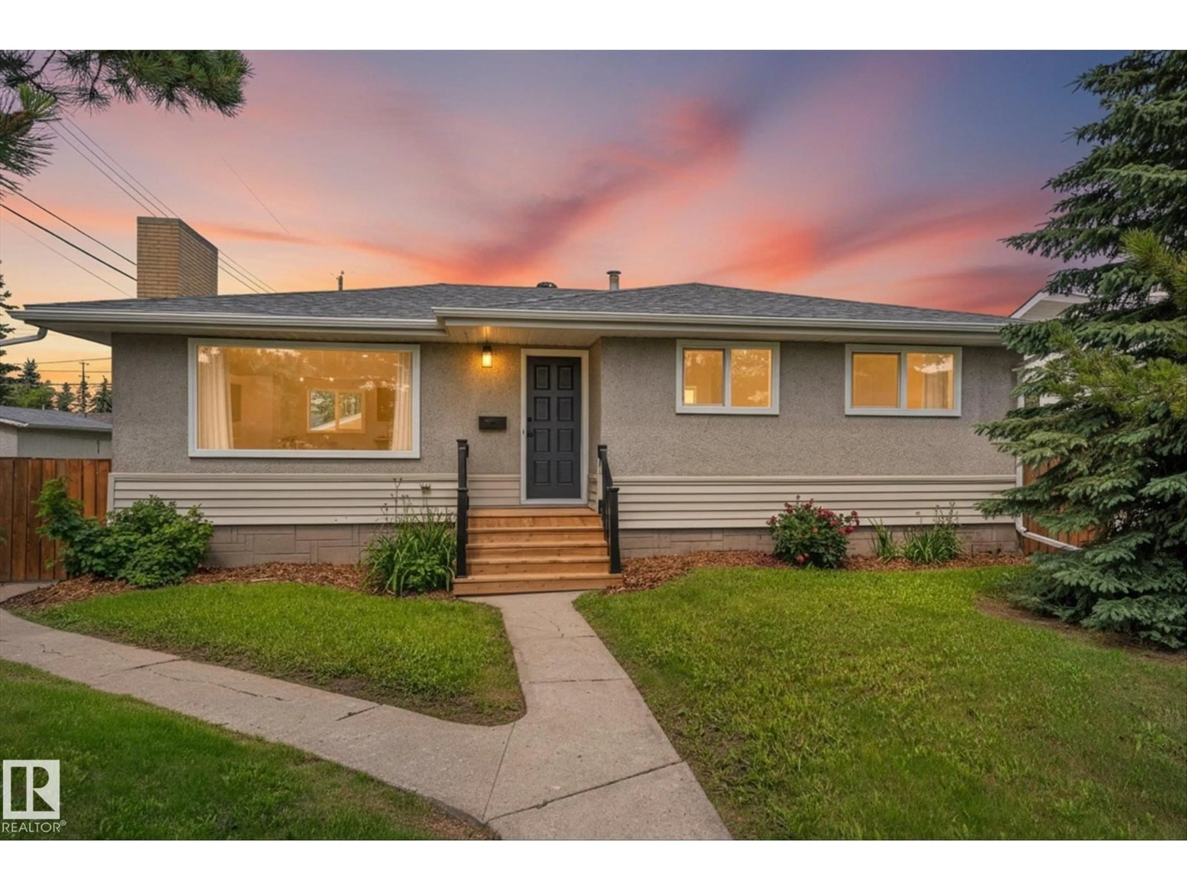 Home with vinyl exterior material, street for 11212 136 AV, Edmonton Alberta T5E1X1