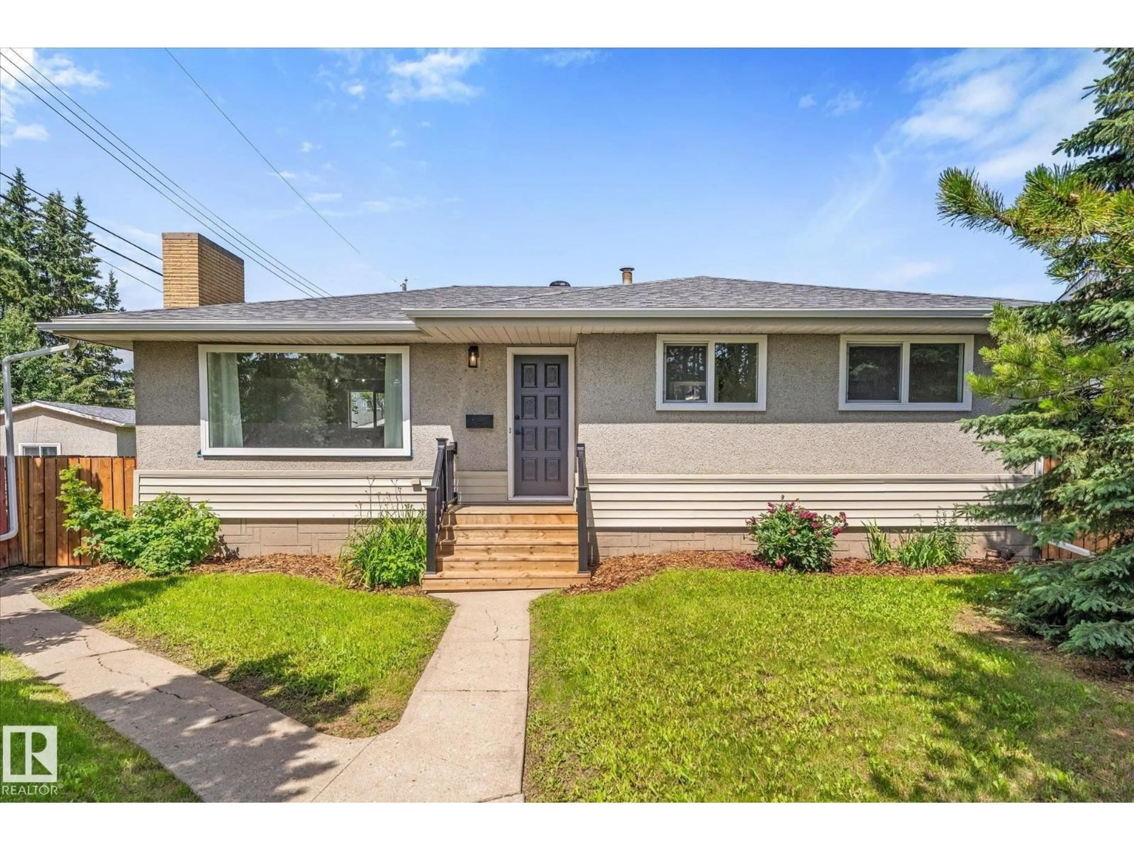 Home with vinyl exterior material, street for 11212 136 AV, Edmonton Alberta T5E1X1