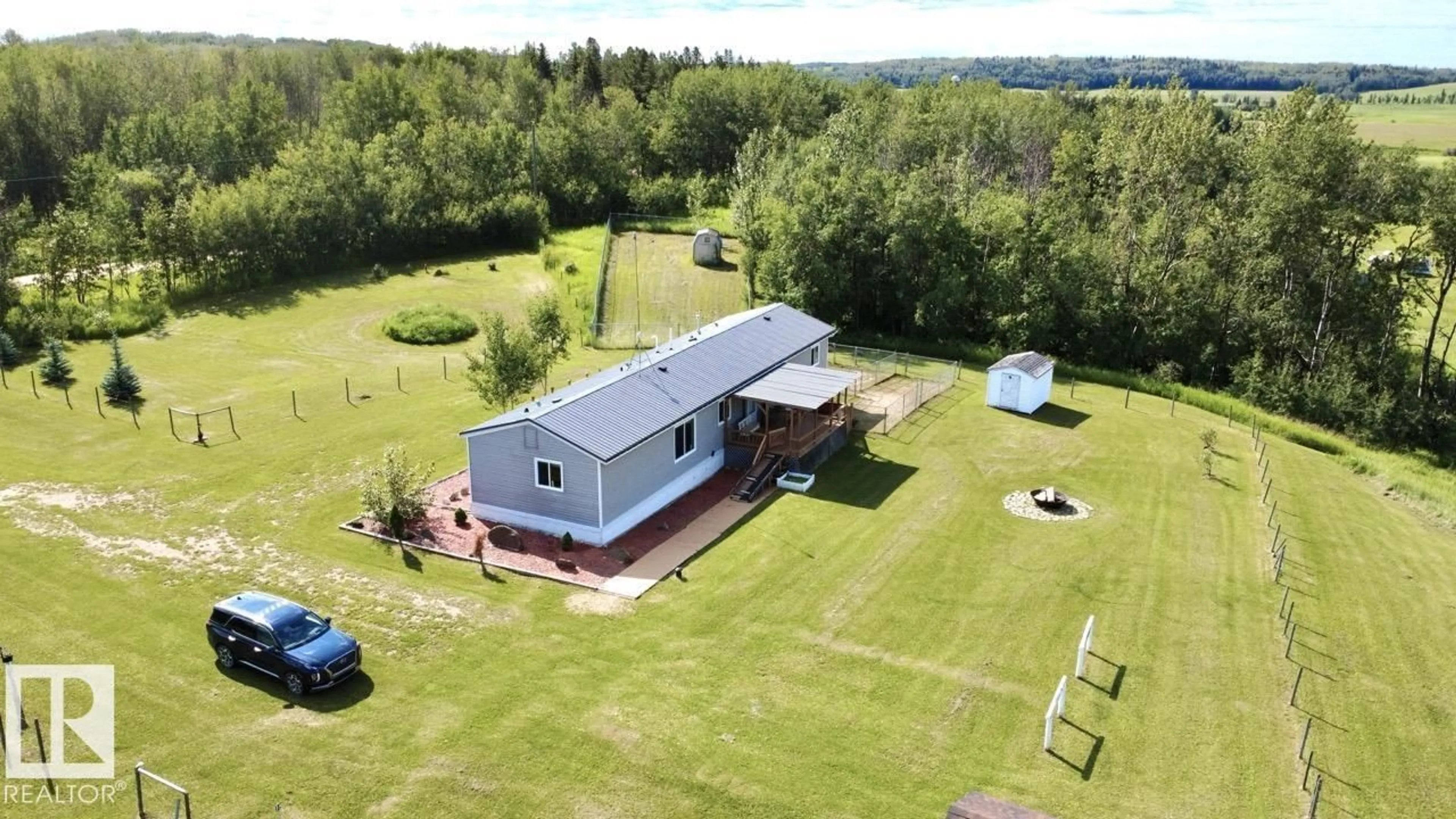 A pic from outside/outdoor area/front of a property/back of a property/a pic from drone, building for 50528 RR 53, Rural Parkland County Alberta T0E2H0