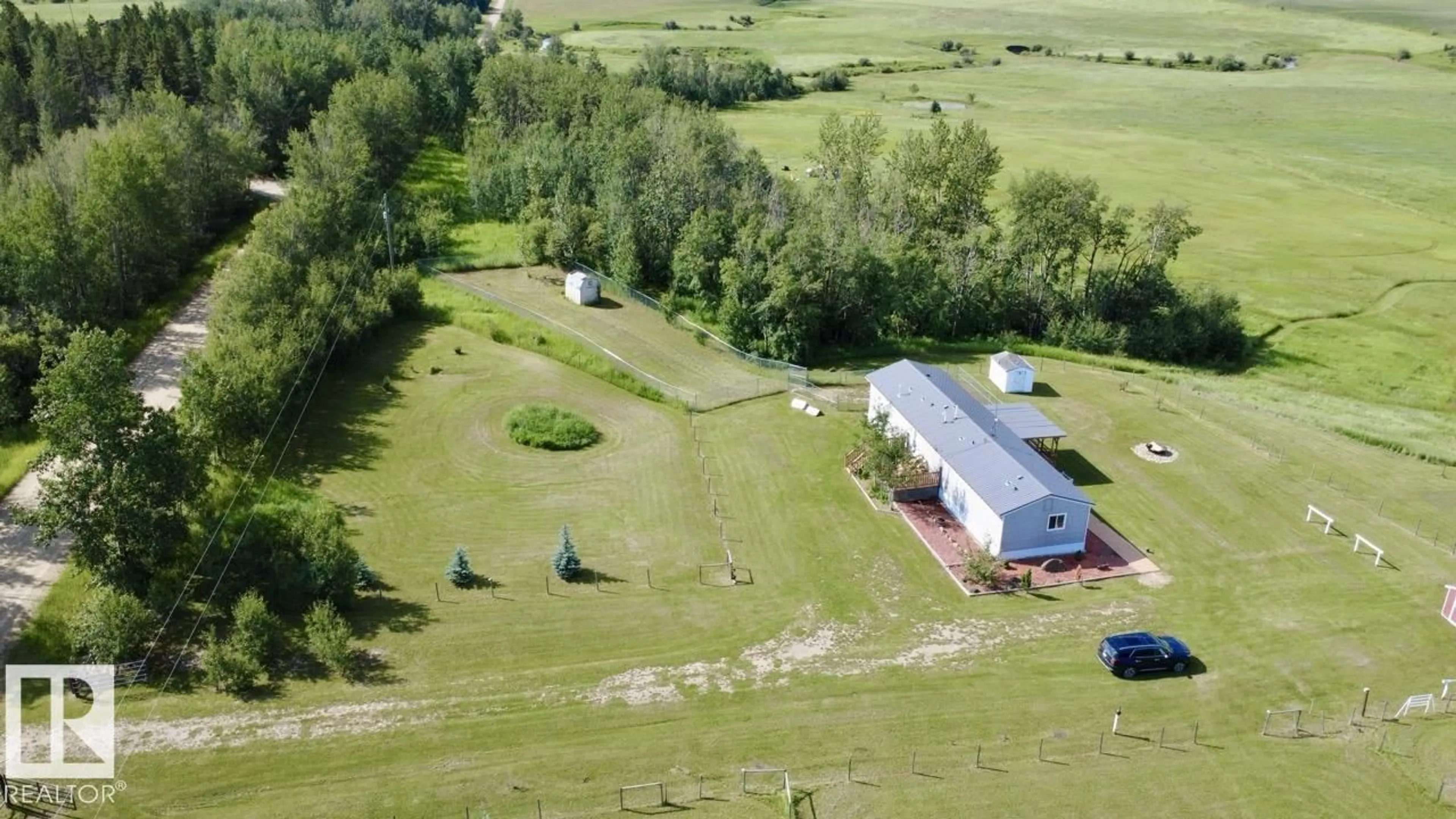 A pic from outside/outdoor area/front of a property/back of a property/a pic from drone, building for 50528 RR 53, Rural Parkland County Alberta T0E2H0