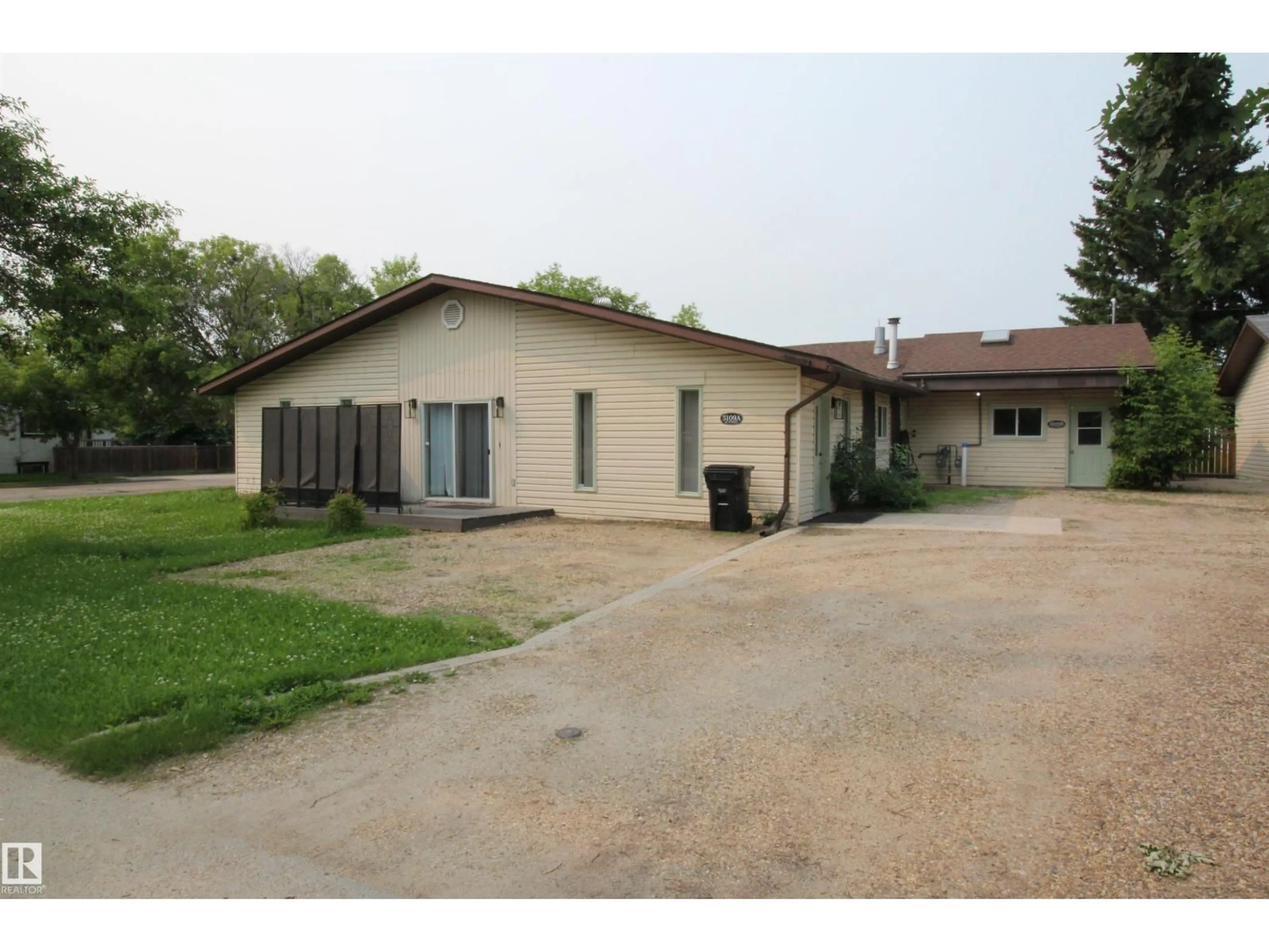 A pic from outside/outdoor area/front of a property/back of a property/a pic from drone, building for 5109 47 ST, Barrhead Alberta T7N1A3