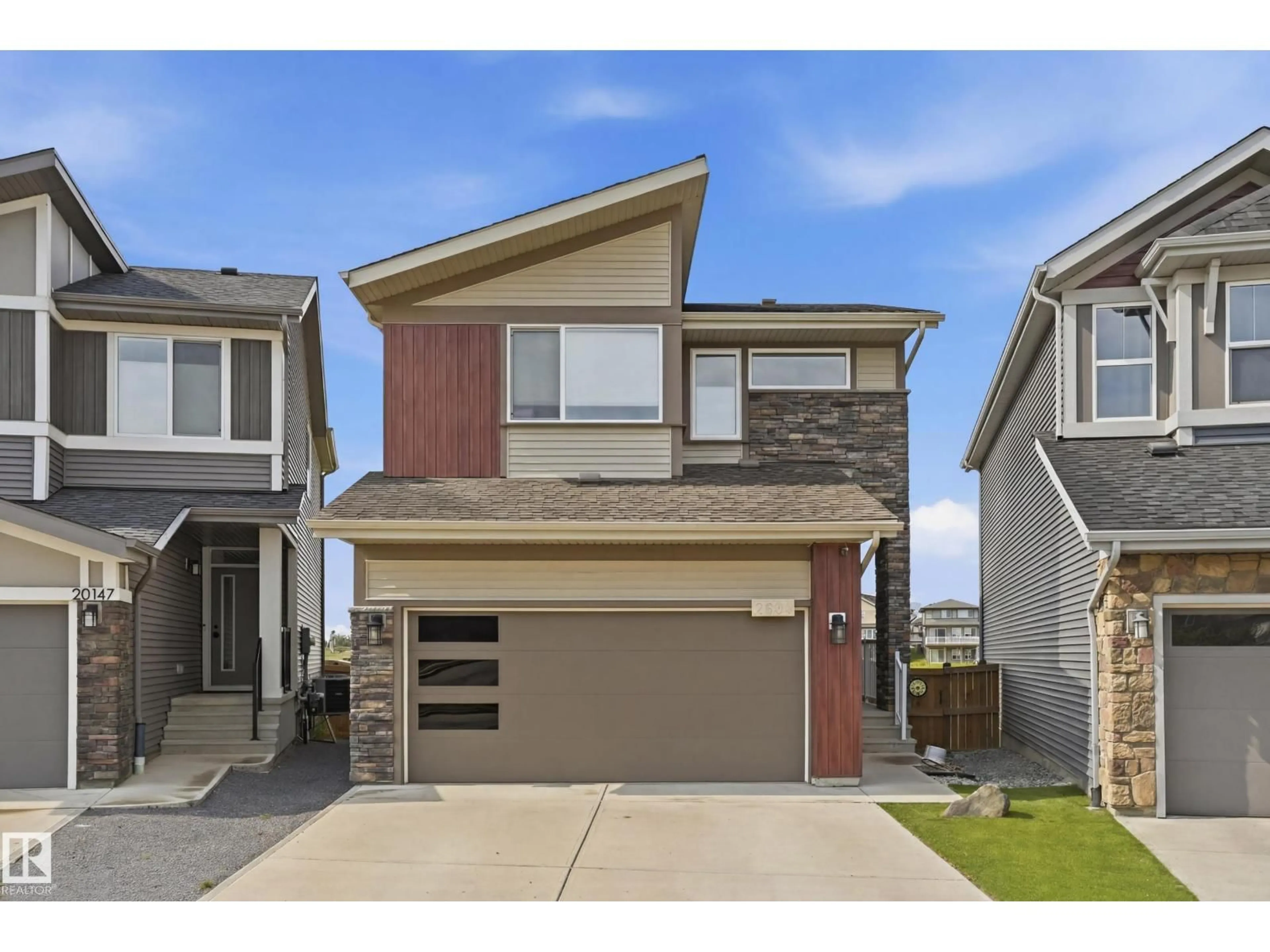 Home with vinyl exterior material, street for NW - 2604 202 ST, Edmonton Alberta T6M1K5
