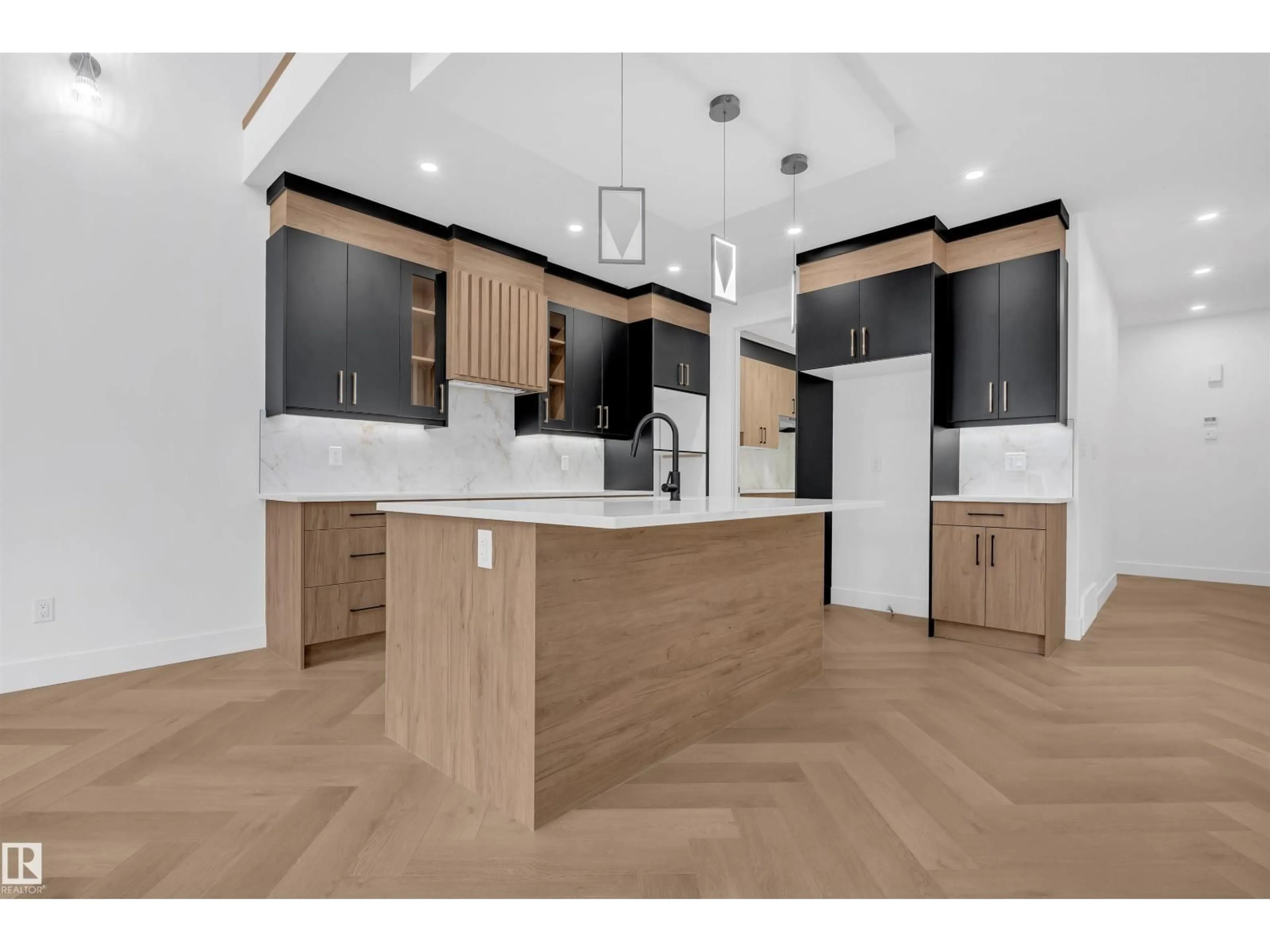 Open concept kitchen, wood/laminate floor for 3604 44 AV, Beaumont Alberta T4X3G8