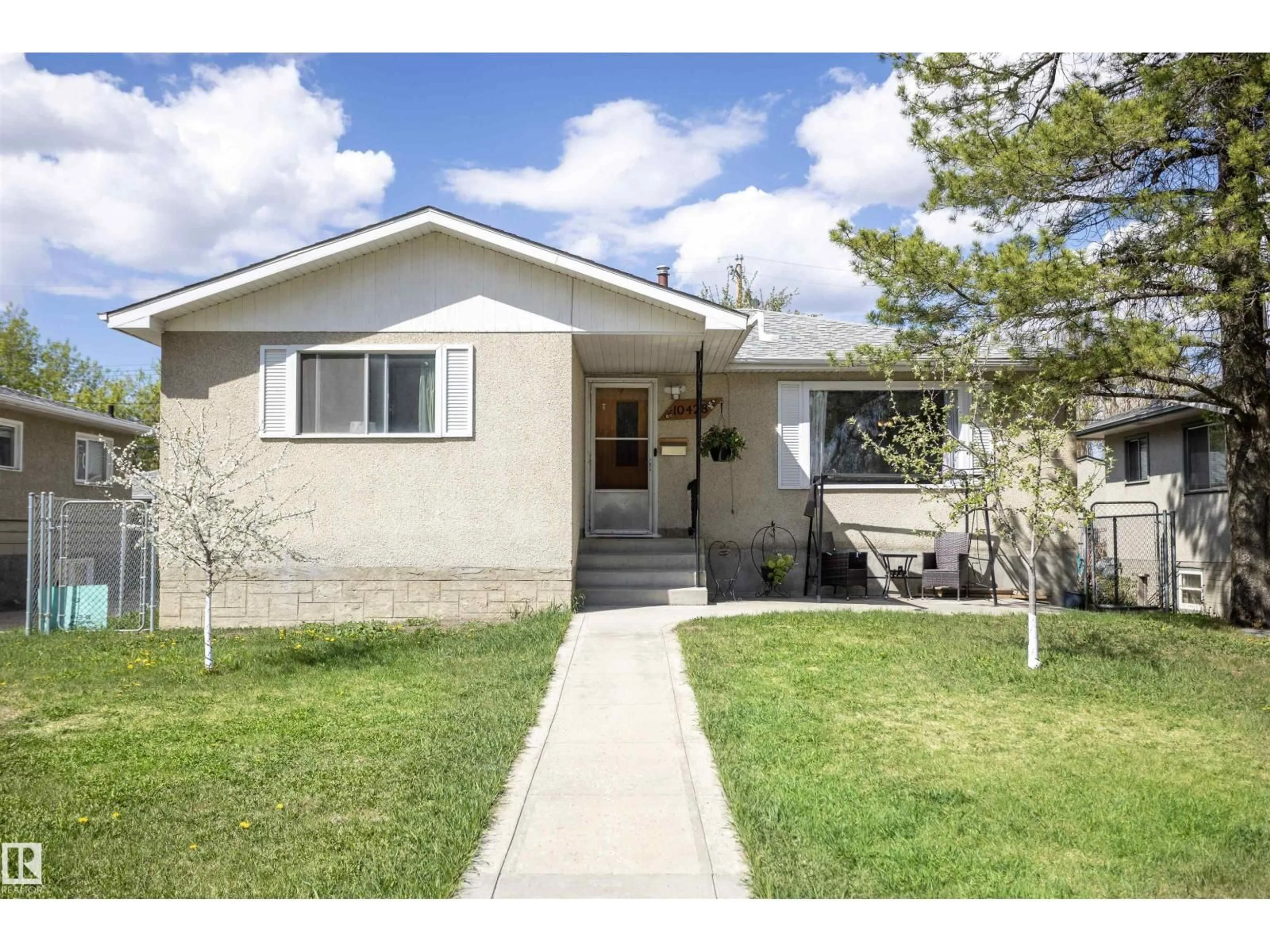 Home with vinyl exterior material, street for NW - 10428 68 AV, Edmonton Alberta T6H2A9