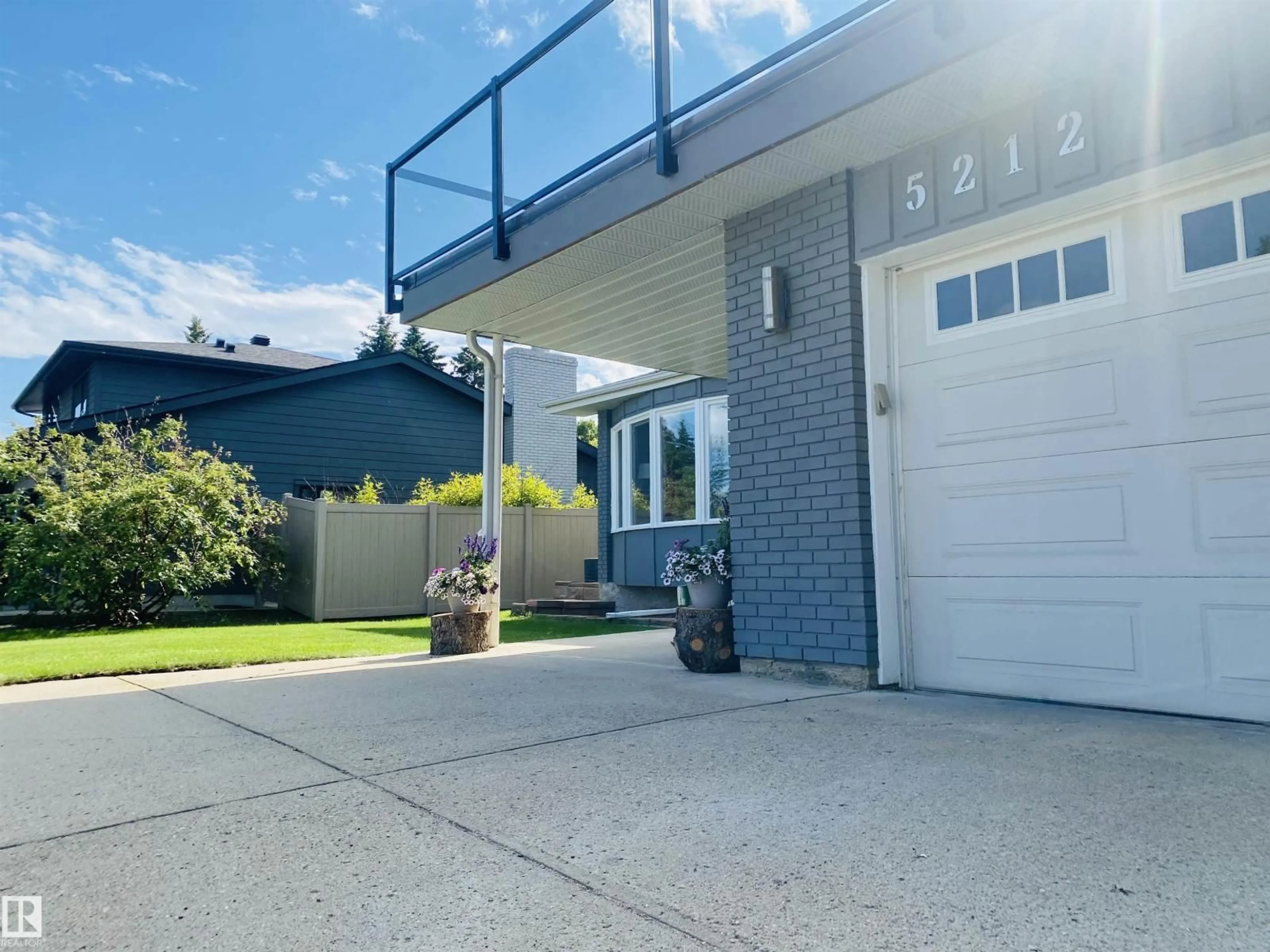 Home with vinyl exterior material, street for NW - 5212 142 ST, Edmonton Alberta T6H4B4