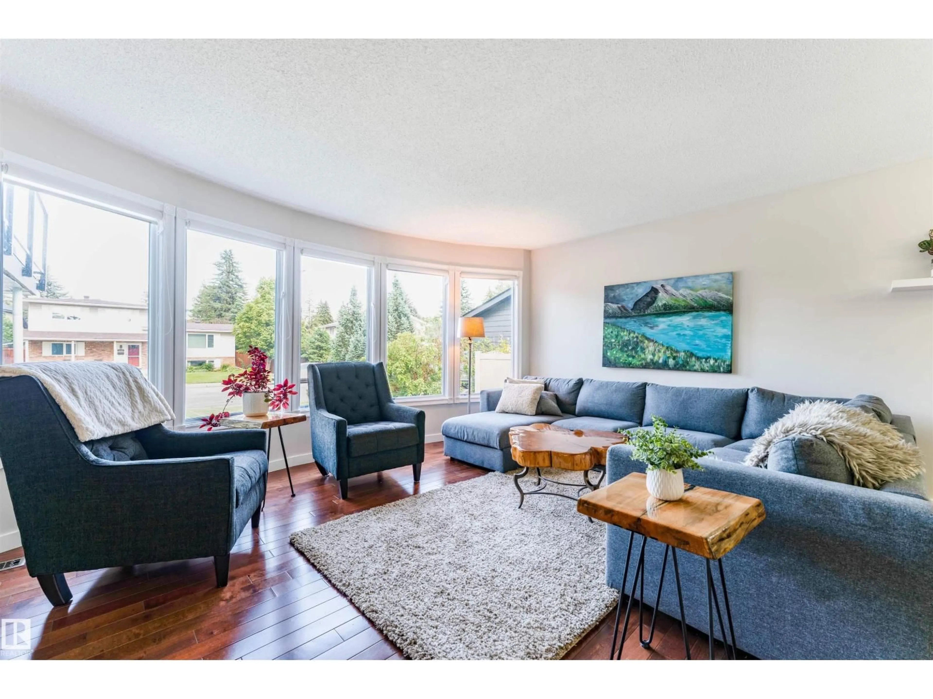 Living room with furniture, wood/laminate floor for NW - 5212 142 ST, Edmonton Alberta T6H4B4