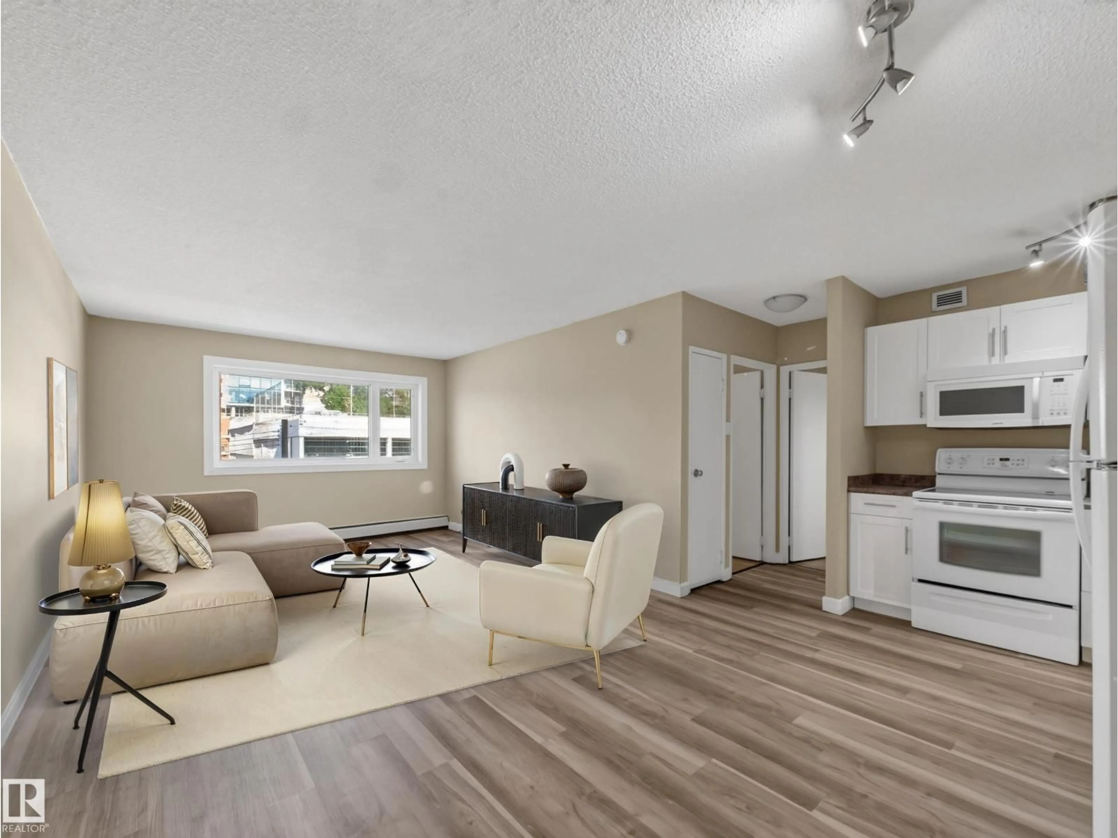 Living room with furniture, wood/laminate floor for #502 - 9710 105 ST, Edmonton Alberta T5K1A4