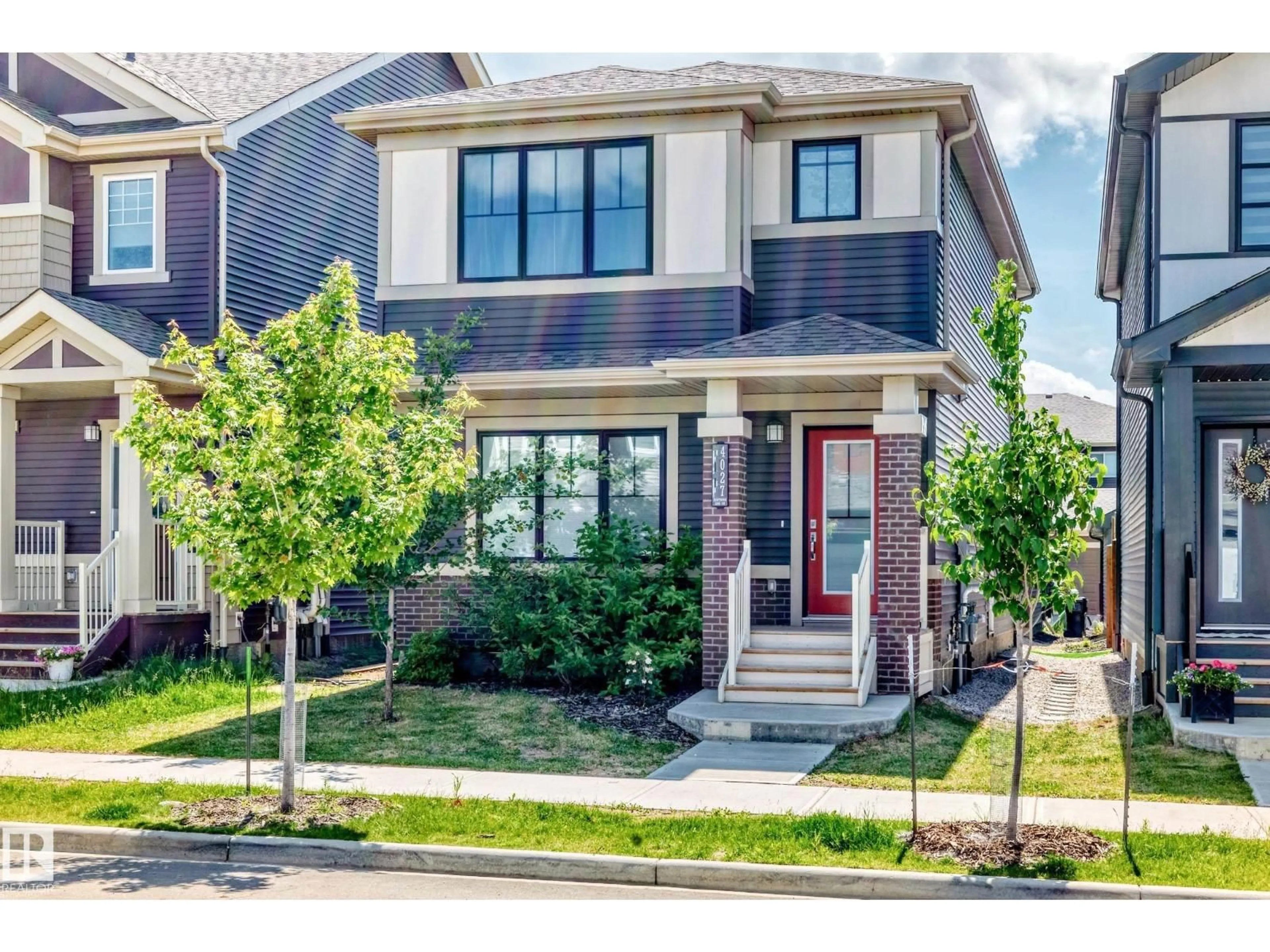 Home with vinyl exterior material, street for SW - 4027 HAWTHORN LI, Edmonton Alberta T6X1Y6
