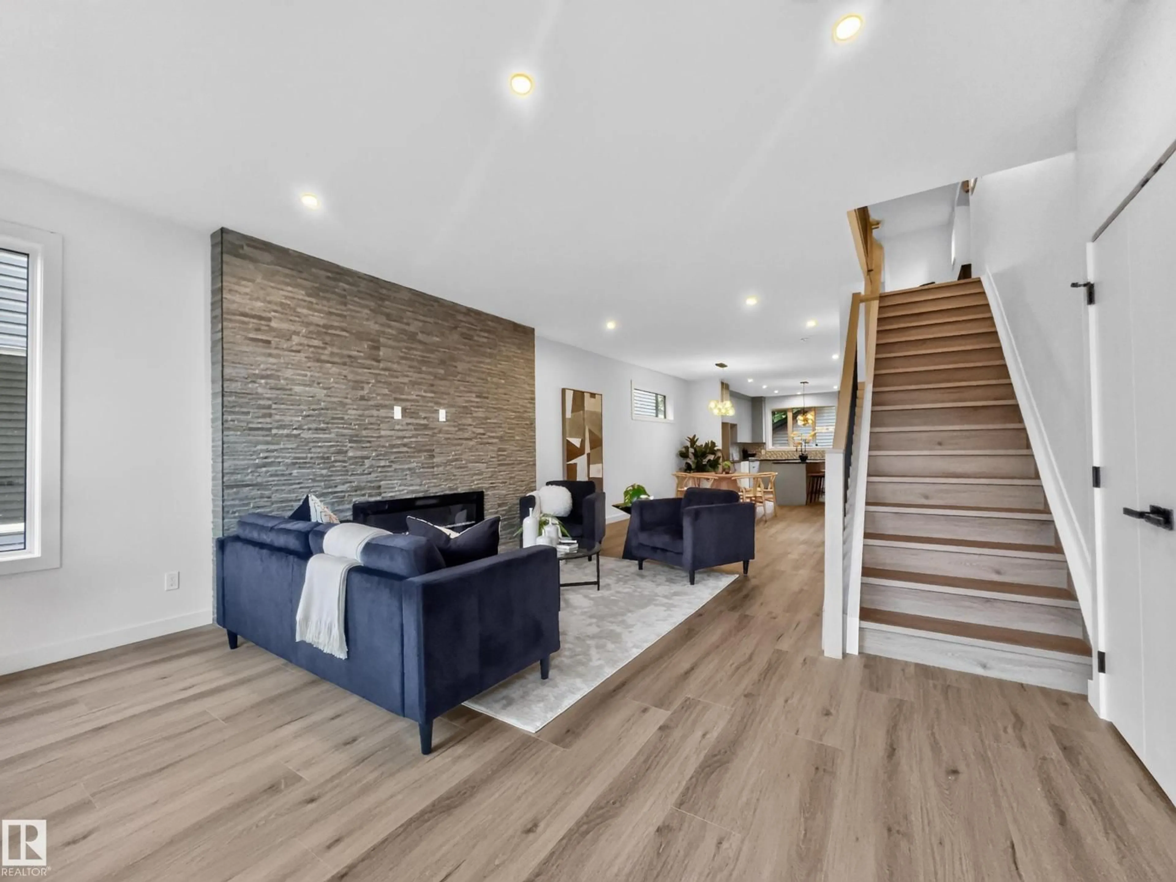 Living room with furniture, wood/laminate floor for 8711 149 ST, Edmonton Alberta T5R1B5