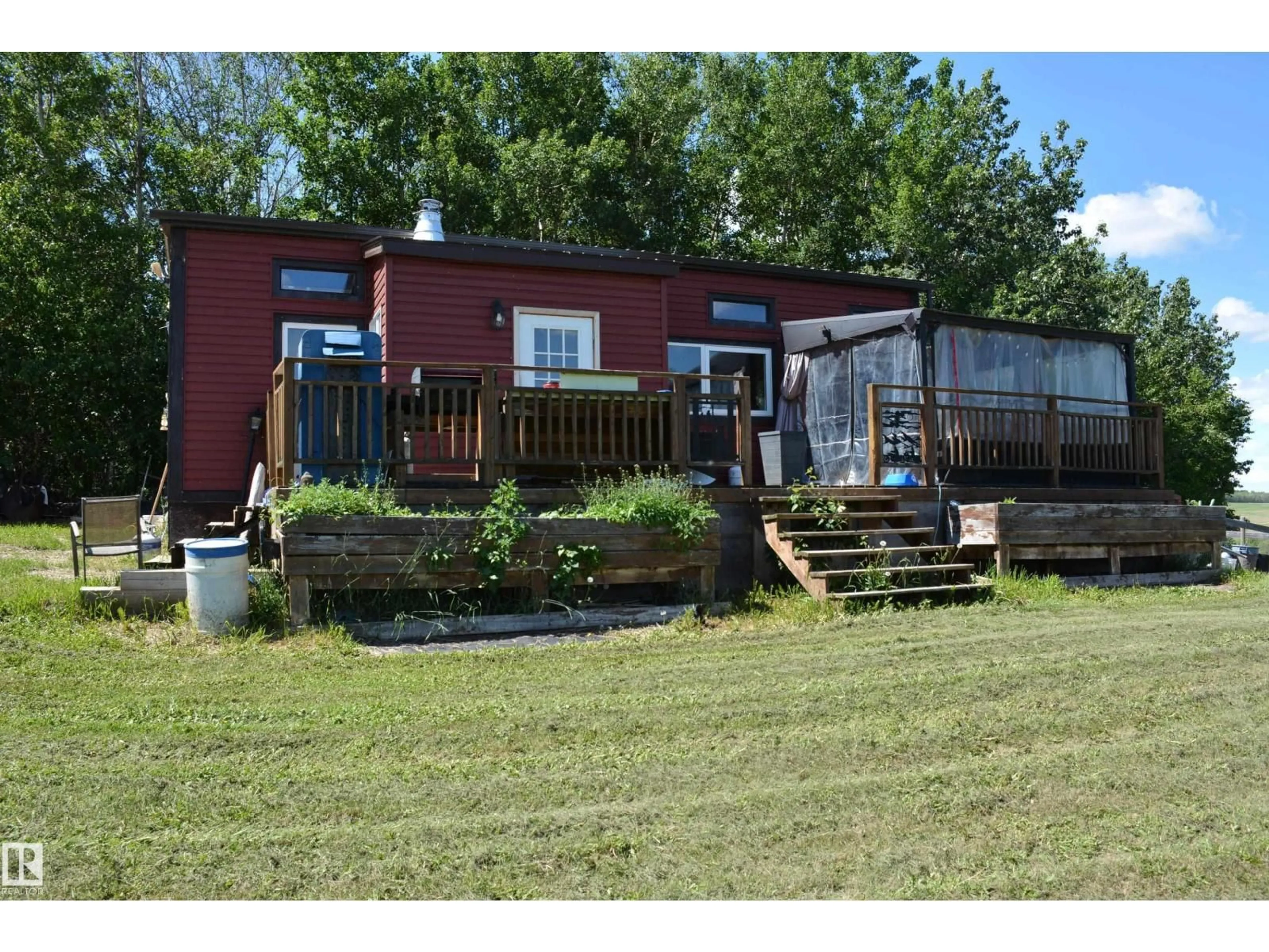 A pic from outside/outdoor area/front of a property/back of a property/a pic from drone, water/lake/river/ocean view for 5102 TWP RD 602, Rural Barrhead County Alberta T7N1A2