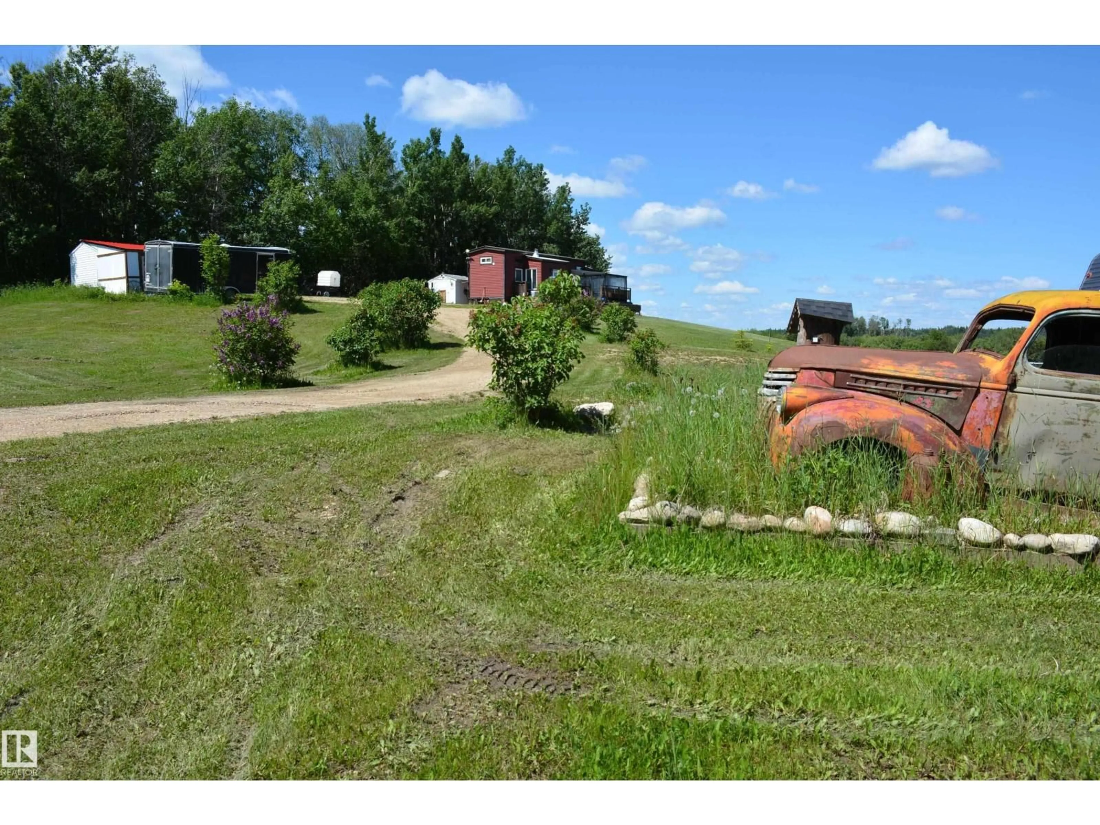 A pic from outside/outdoor area/front of a property/back of a property/a pic from drone, street for 5102 TWP RD 602, Rural Barrhead County Alberta T7N1A2