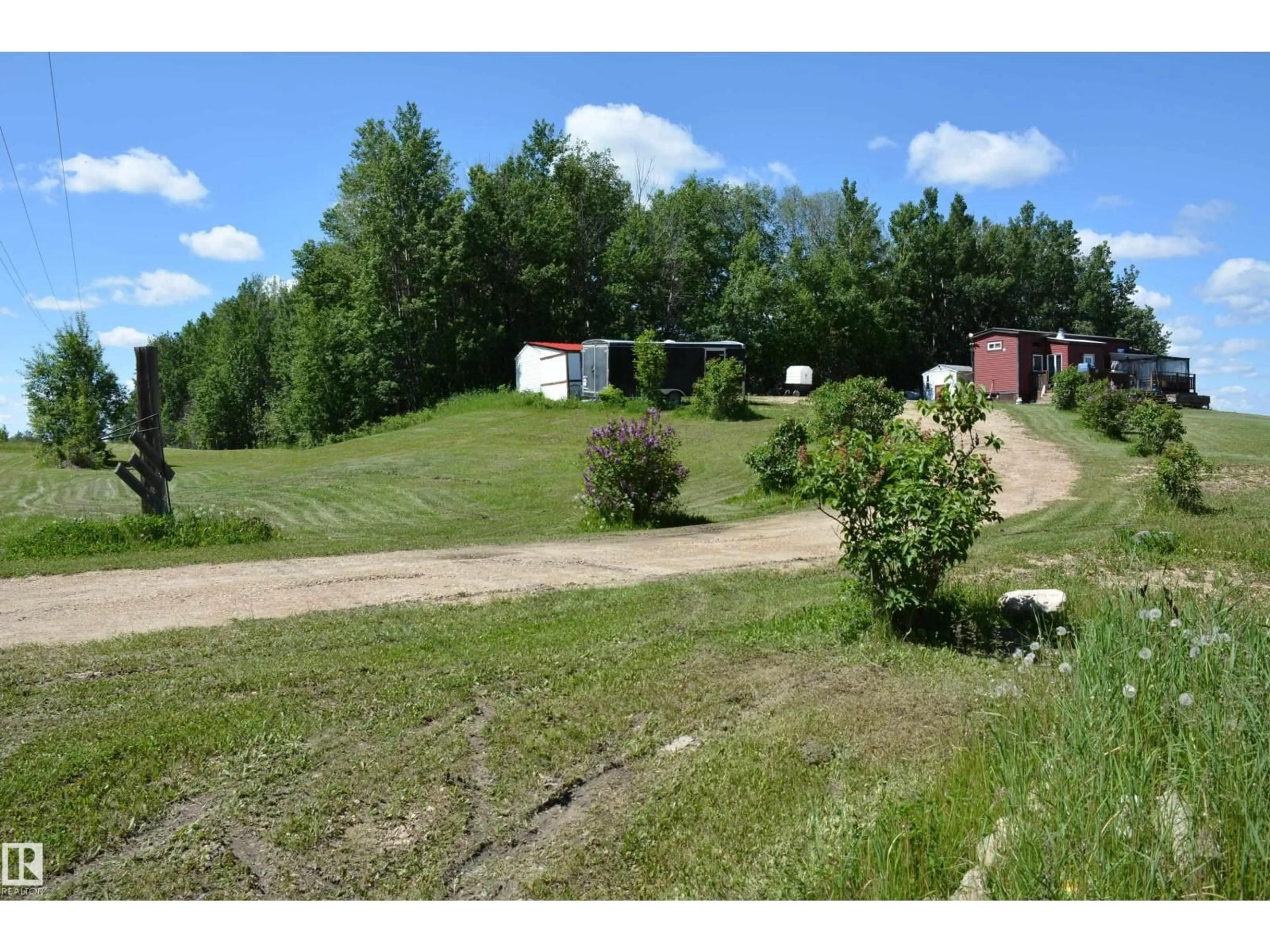 A pic from outside/outdoor area/front of a property/back of a property/a pic from drone, mountain view for 5102 TWP RD 602, Rural Barrhead County Alberta T7N1A2