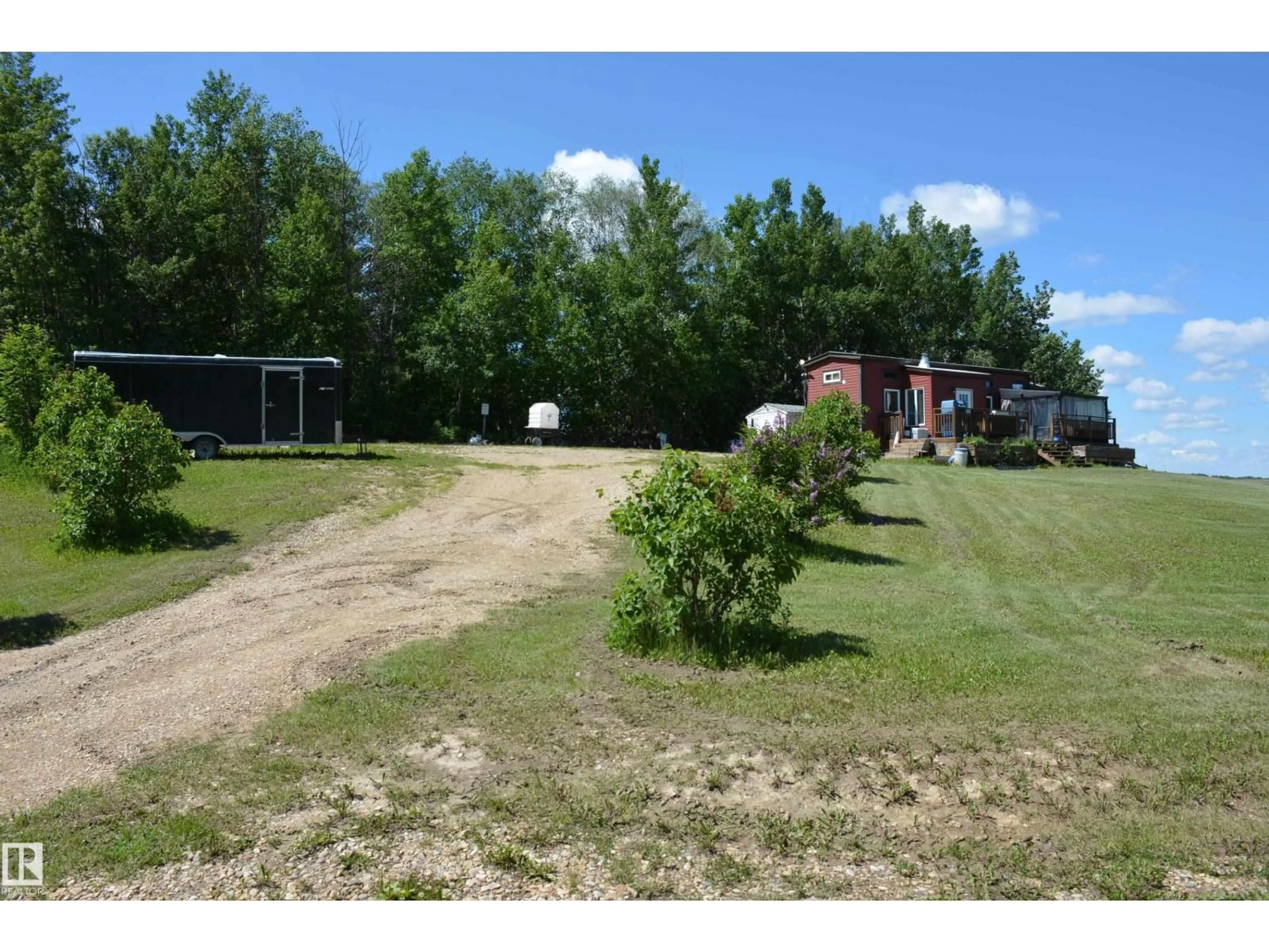 A pic from outside/outdoor area/front of a property/back of a property/a pic from drone, unknown for 5102 TWP RD 602, Rural Barrhead County Alberta T7N1A2