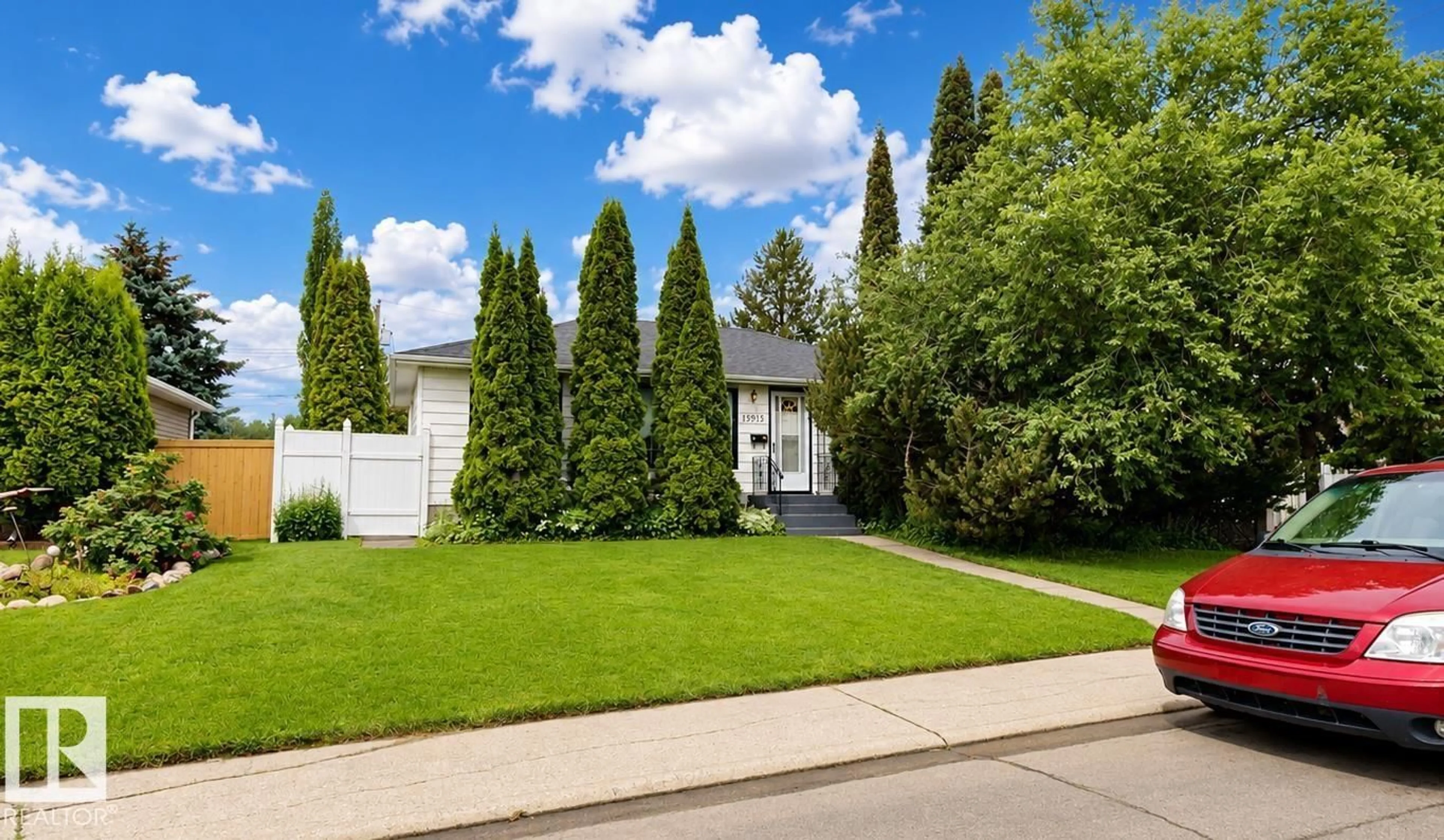 Home with vinyl exterior material, street for 13915 135A AV, Edmonton Alberta T5L4A1