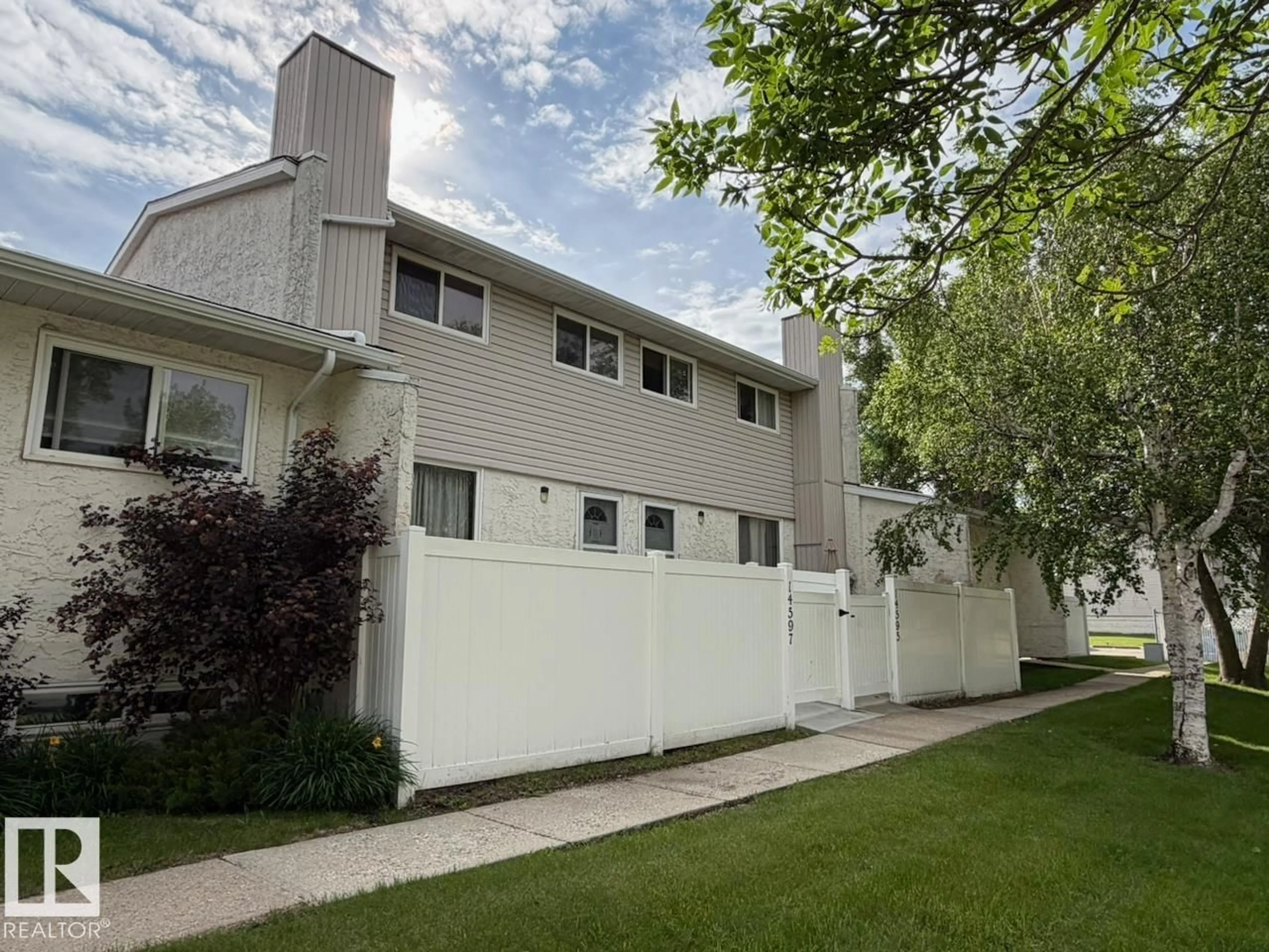 Home with vinyl exterior material, street for NW - 14597 121 ST, Edmonton Alberta T5X2S2