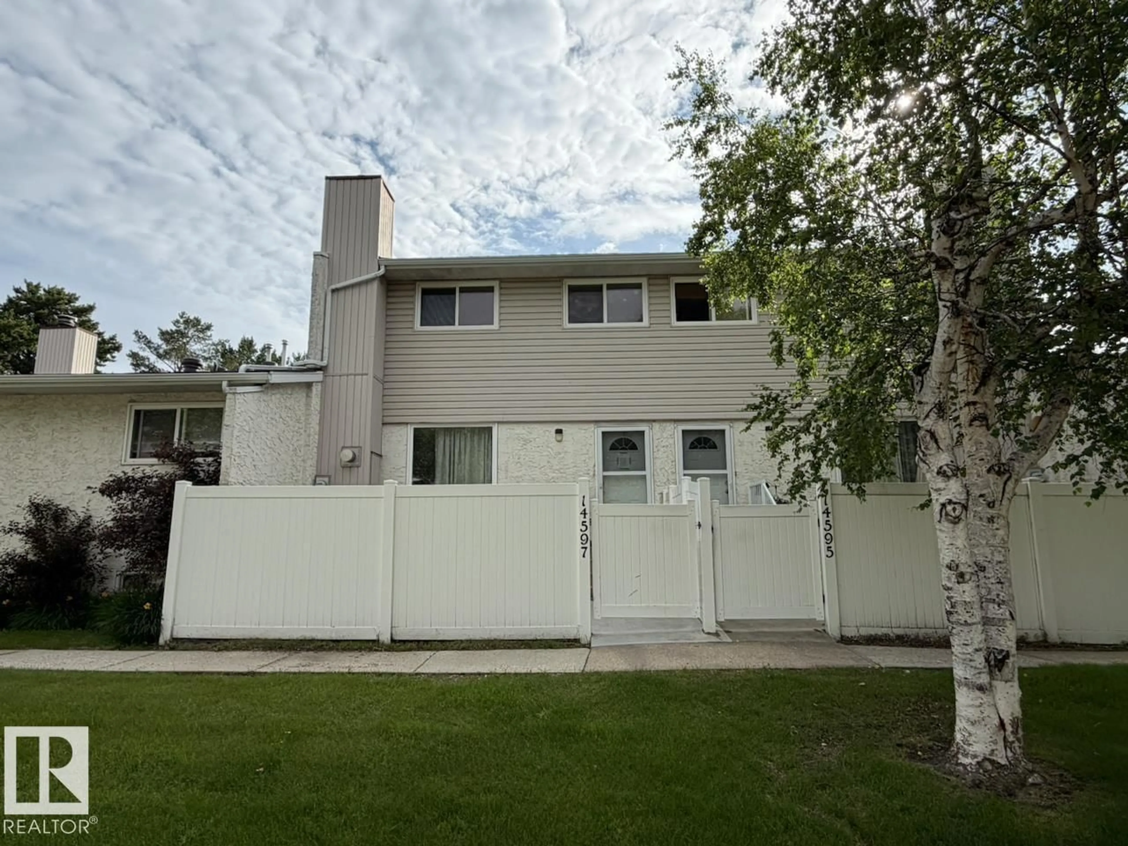 Home with vinyl exterior material, street for NW - 14597 121 ST, Edmonton Alberta T5X2S2