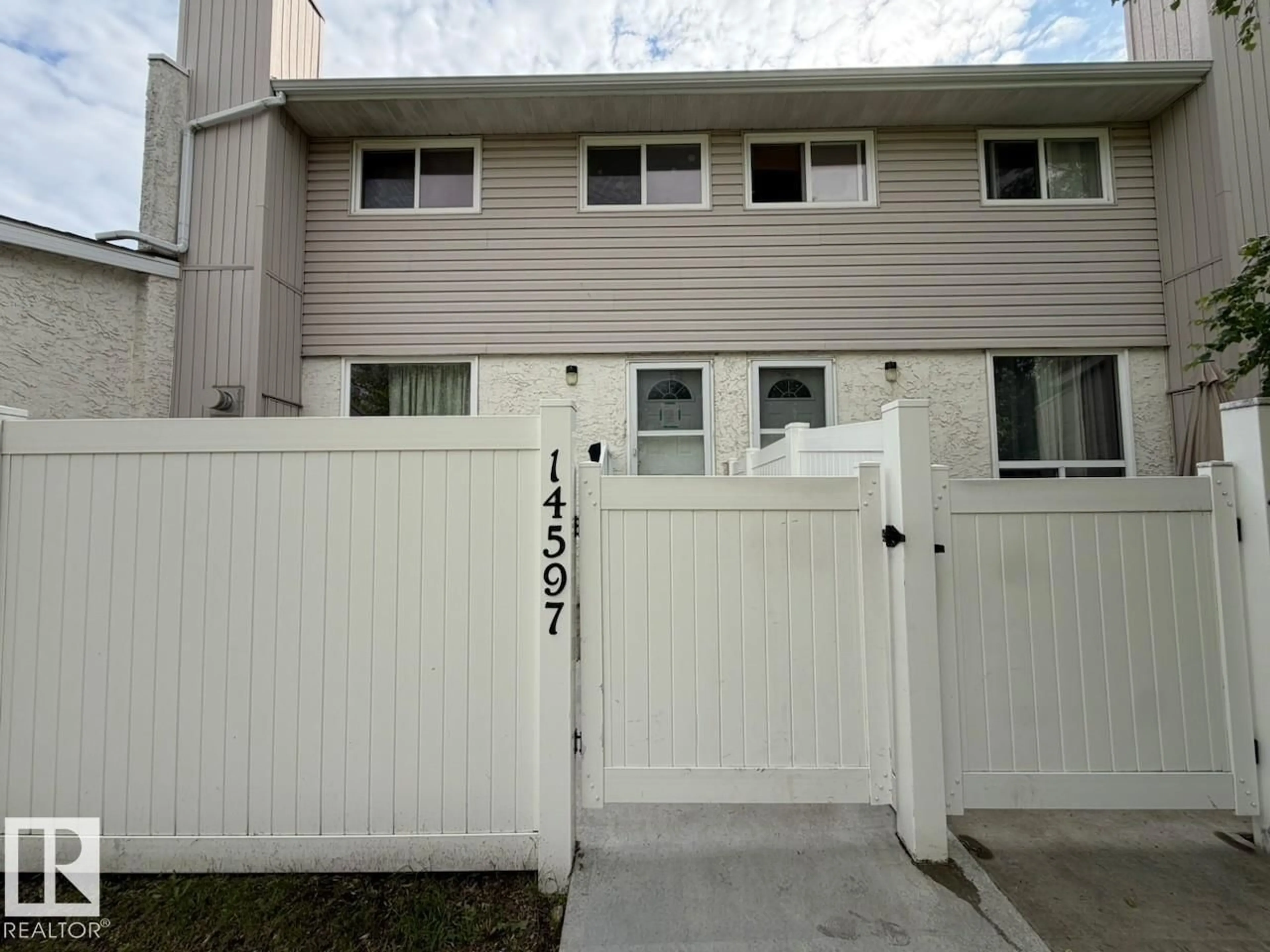 Home with vinyl exterior material, street for NW - 14597 121 ST, Edmonton Alberta T5X2S2