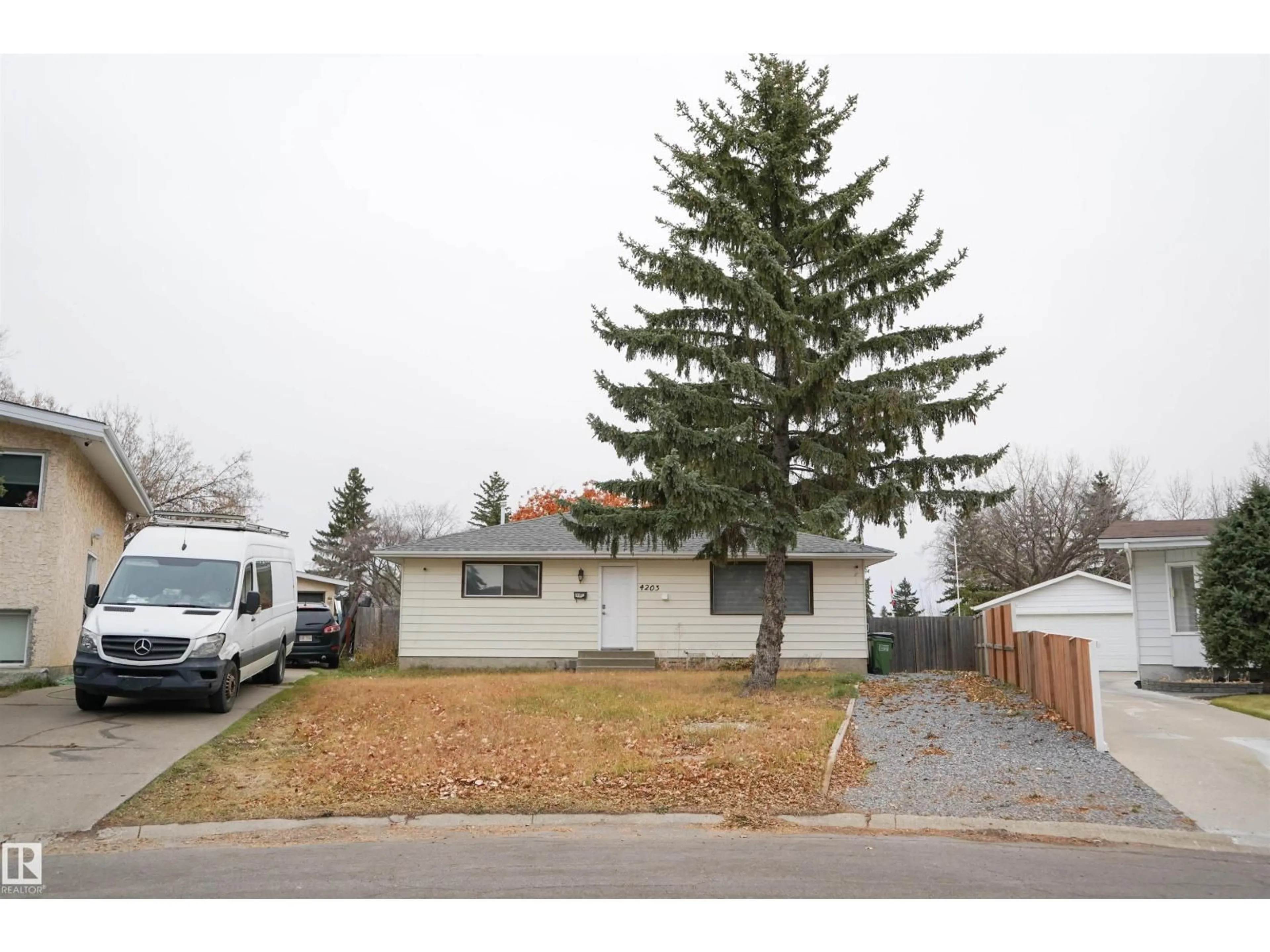Home with vinyl exterior material, street for 4203 83 ST, Edmonton Alberta T6K1C8