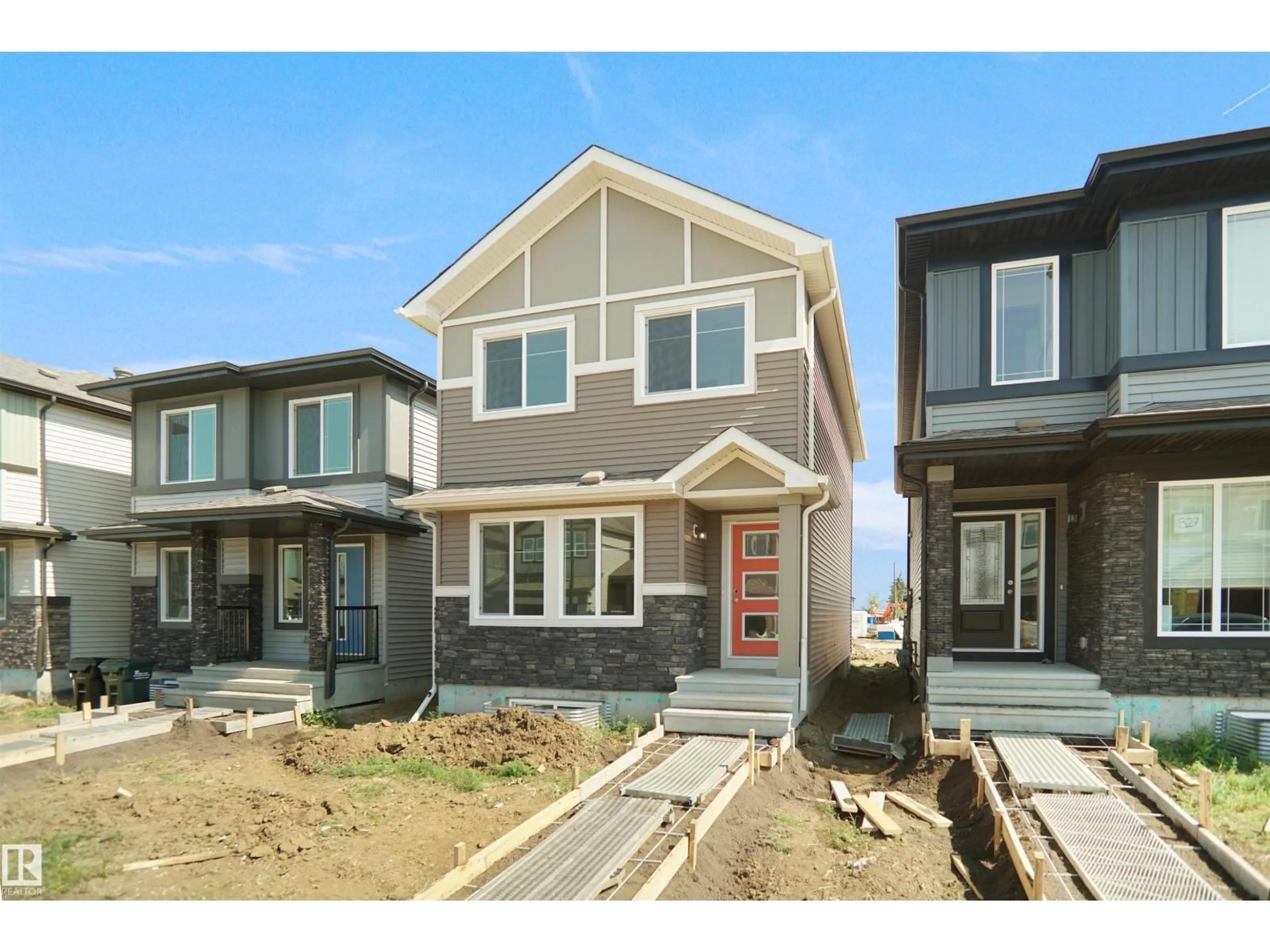 Home with vinyl exterior material, street for NW - 21027 25 AV, Edmonton Alberta T5Y4G2