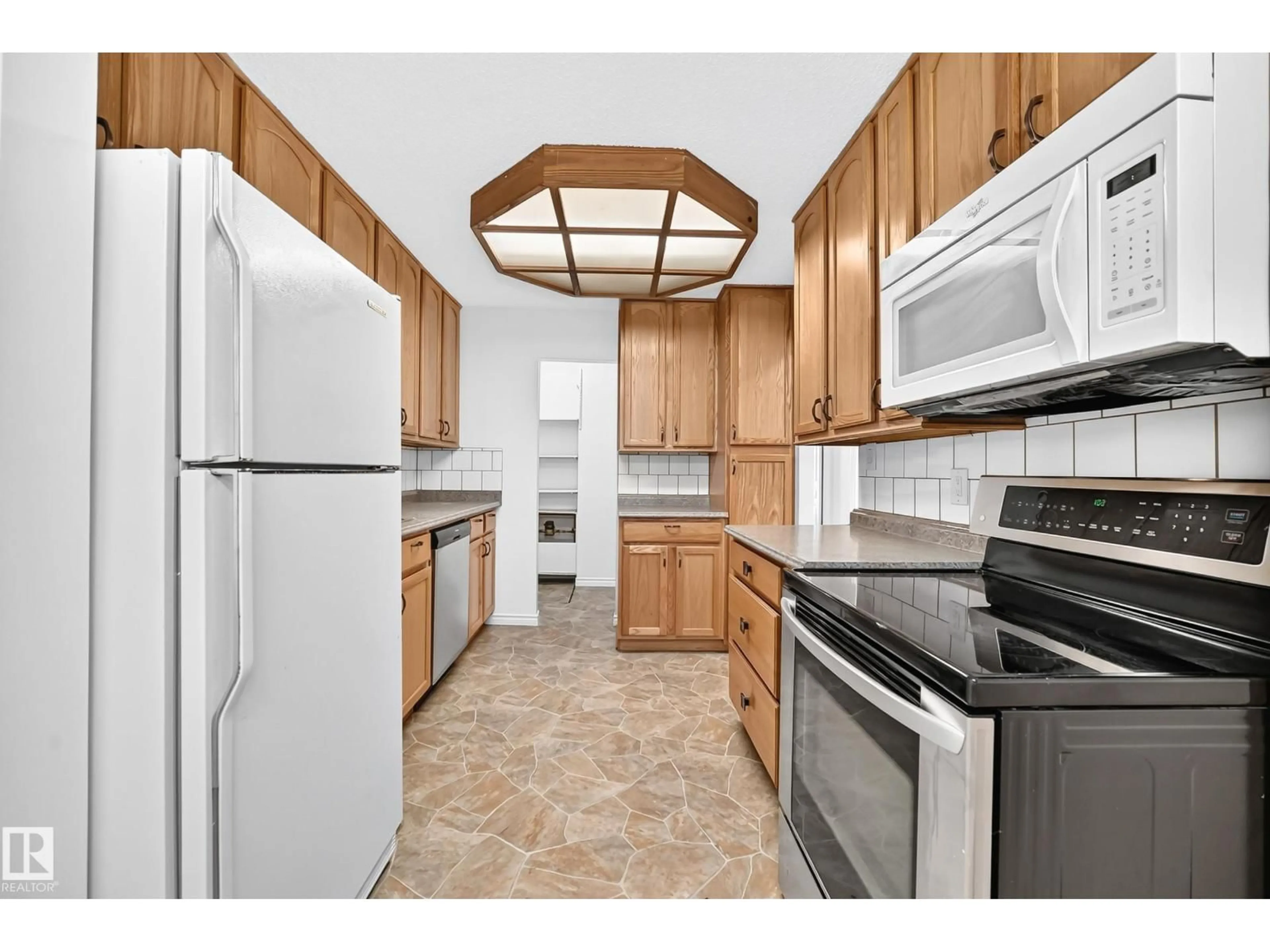 Standard kitchen, unknown for #40 - 3111 142 AV, Edmonton Alberta T5Y2H6