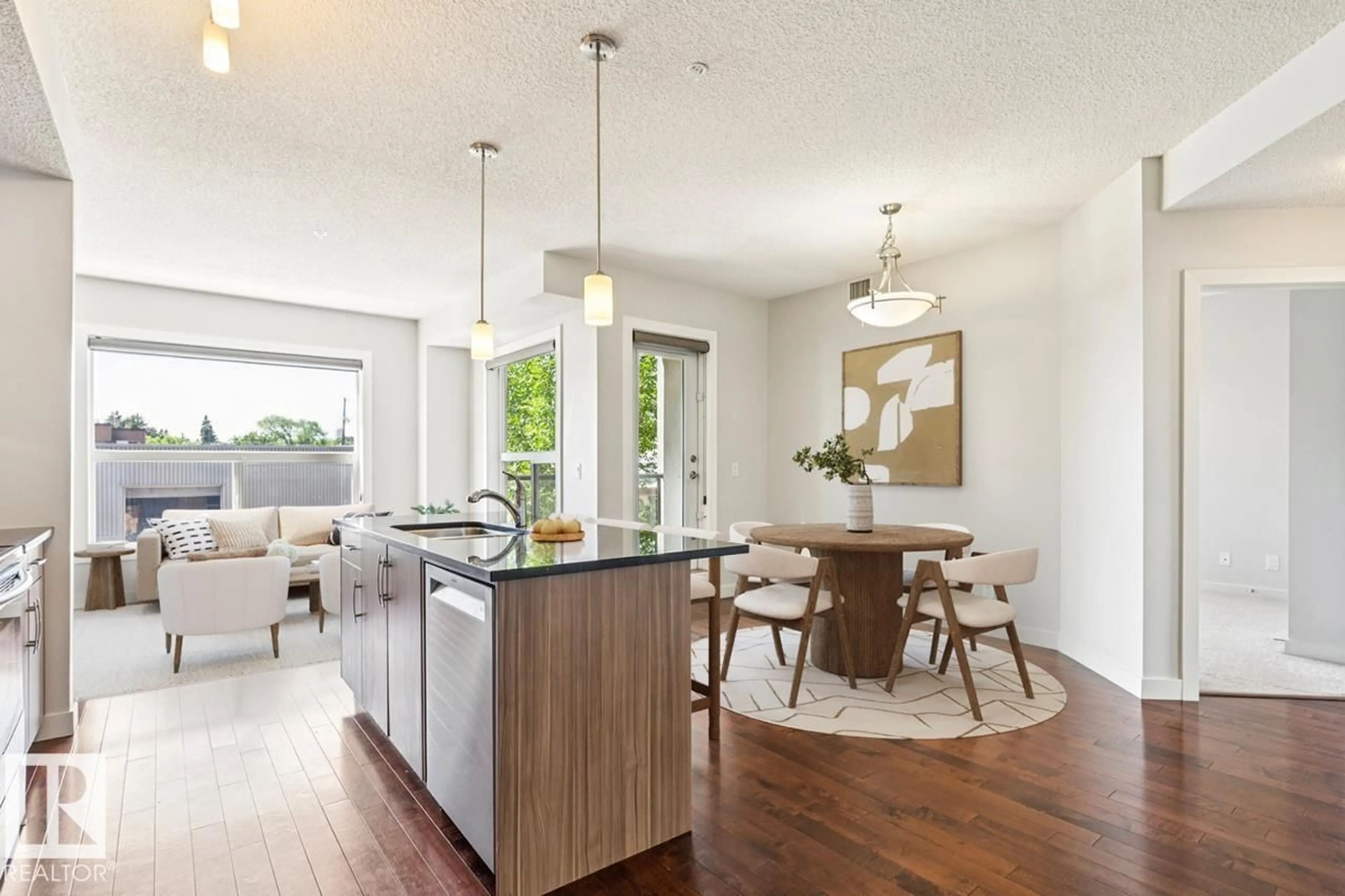 Open concept kitchen, wood/laminate floor for 217 10523 123 ST NW, Edmonton Alberta T5N1N9