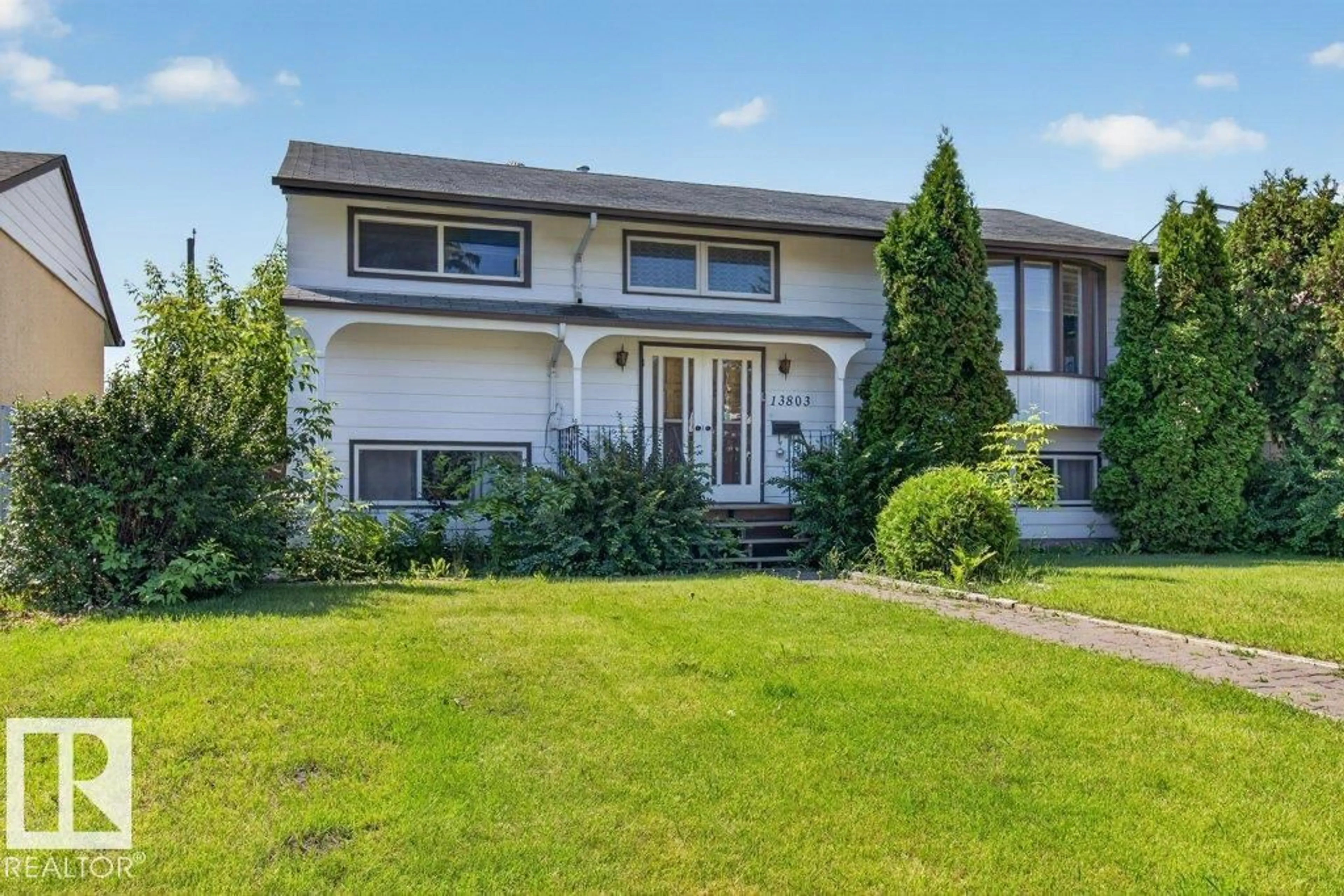 Home with vinyl exterior material, street for 13803 133 AV, Edmonton Alberta T5L3T3